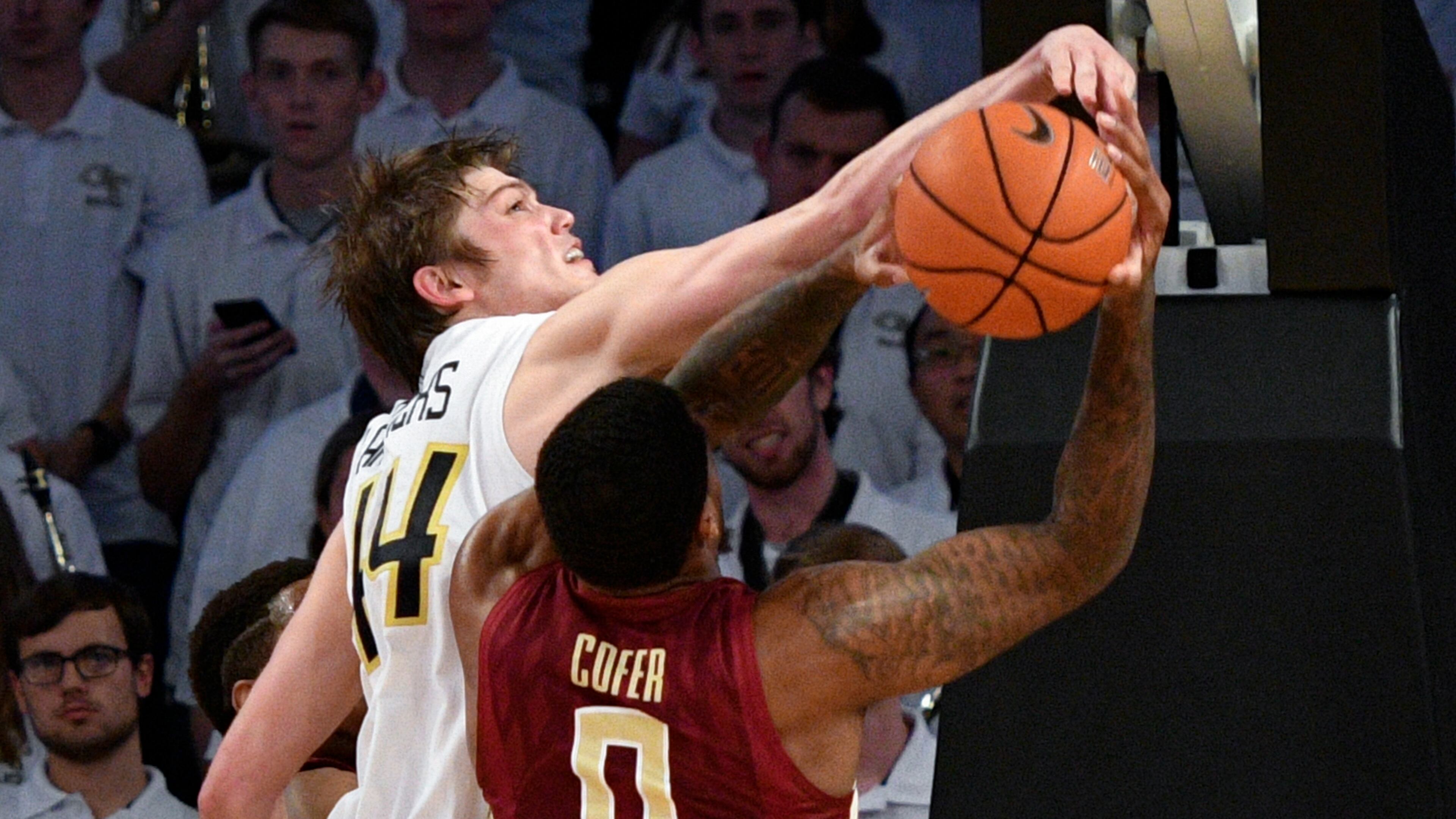 Georgia Tech center Ben Lammers gets his hand on the shot of Florida State forward Phil Cofer during the second half of an NCAA basketball game Wednesday, Jan. 25, 2017, in Atlanta. Georgia Tech won 78-56. (AP Photo/John Amis)