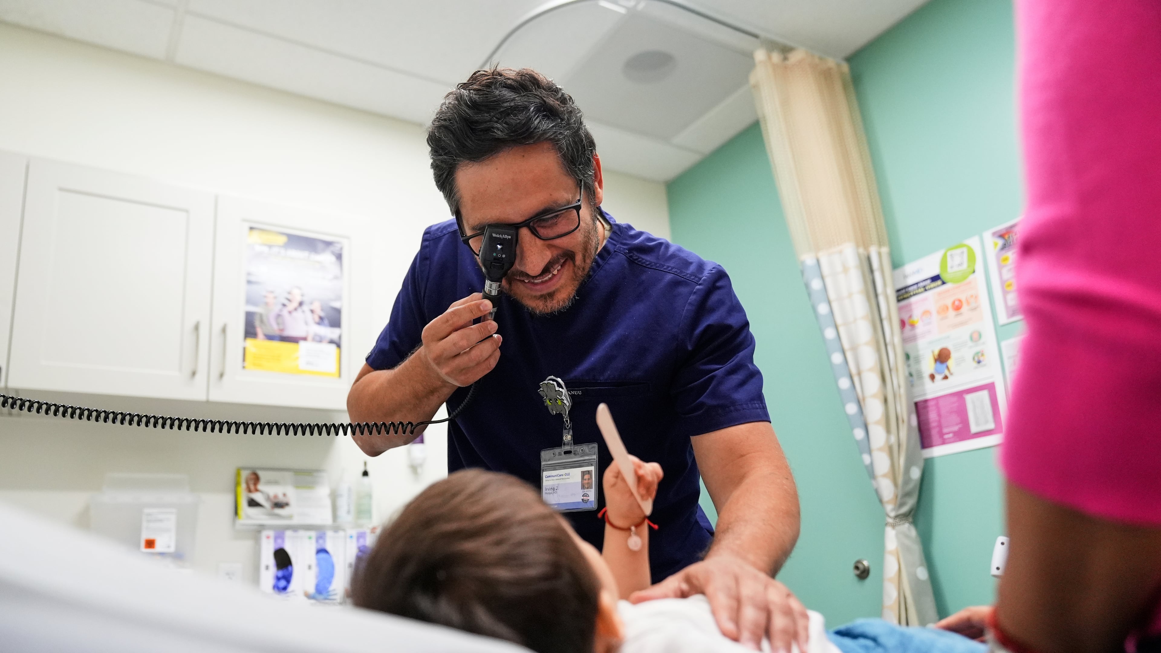 FILE - Pediatrician Irving Phillips examines a 16-month-old boy at a CommuniCARE+OLE clinic, June 26, 2025, in Davis, Calif. (AP Photo/Godofredo A. Vásquez, File)