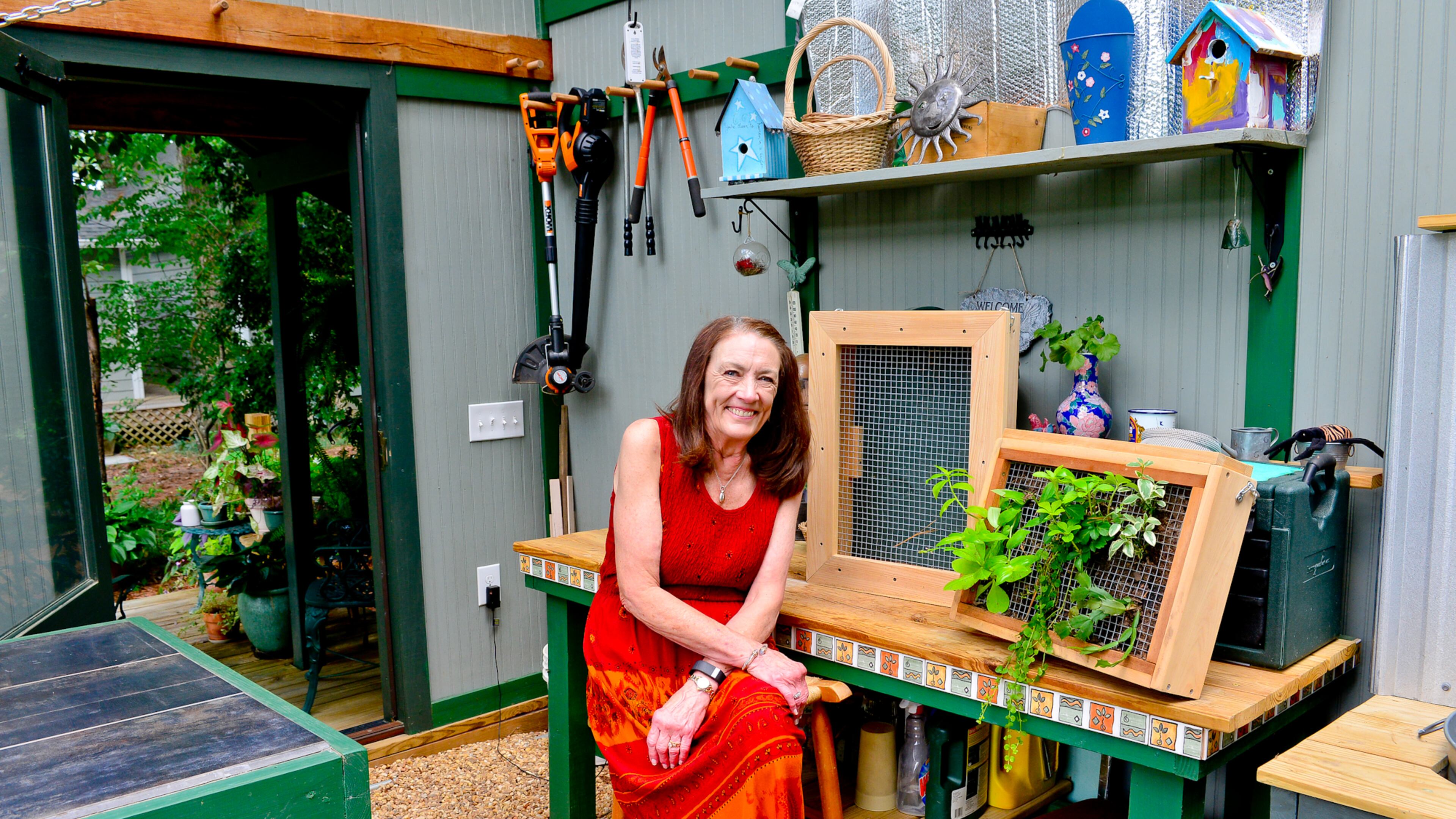 Teresa Stoker, who is retired, sits in her greenhouse/workhouse combination, where she grows a variety of plants from seeds to maturity and her husband does woodworking. Text by Lori Johnston and Shannon Adams/Fast Copy News Service.(Christopher Oquendo Photography/www.ophotography.com)
