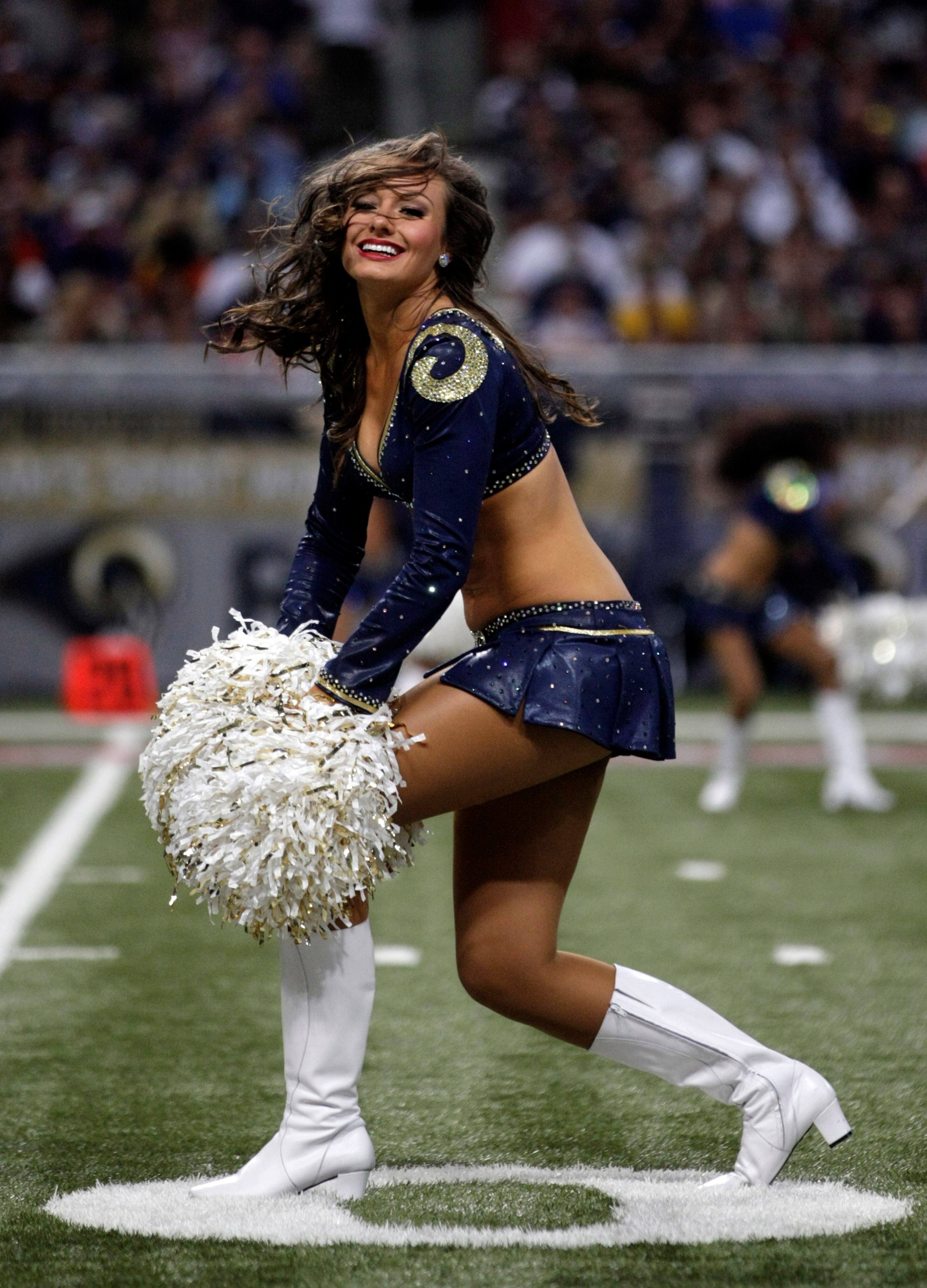 A St. Louis Rams cheerleader performs during the fourth quarter of an NFL football game between the St. Louis Rams and the Dallas Cowboys Sunday, Sept. 21, 2014, in St. Louis. (AP Photo/Tom Gannam)