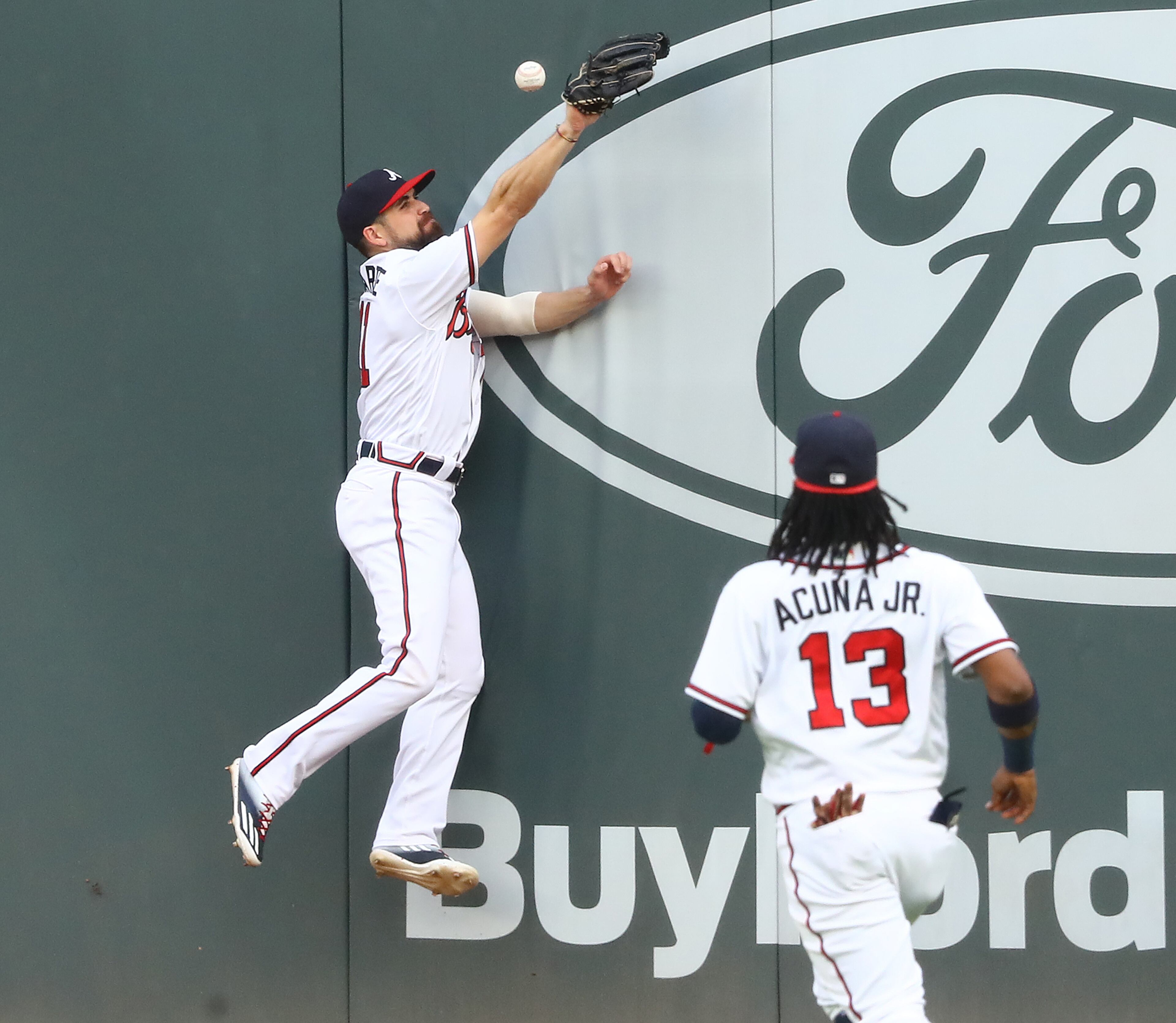 Braves center fielder Ender Inciarte just misses a double off the wall by Cavan Biggio during the first inning. Curtis Compton ccompton@ajc.com