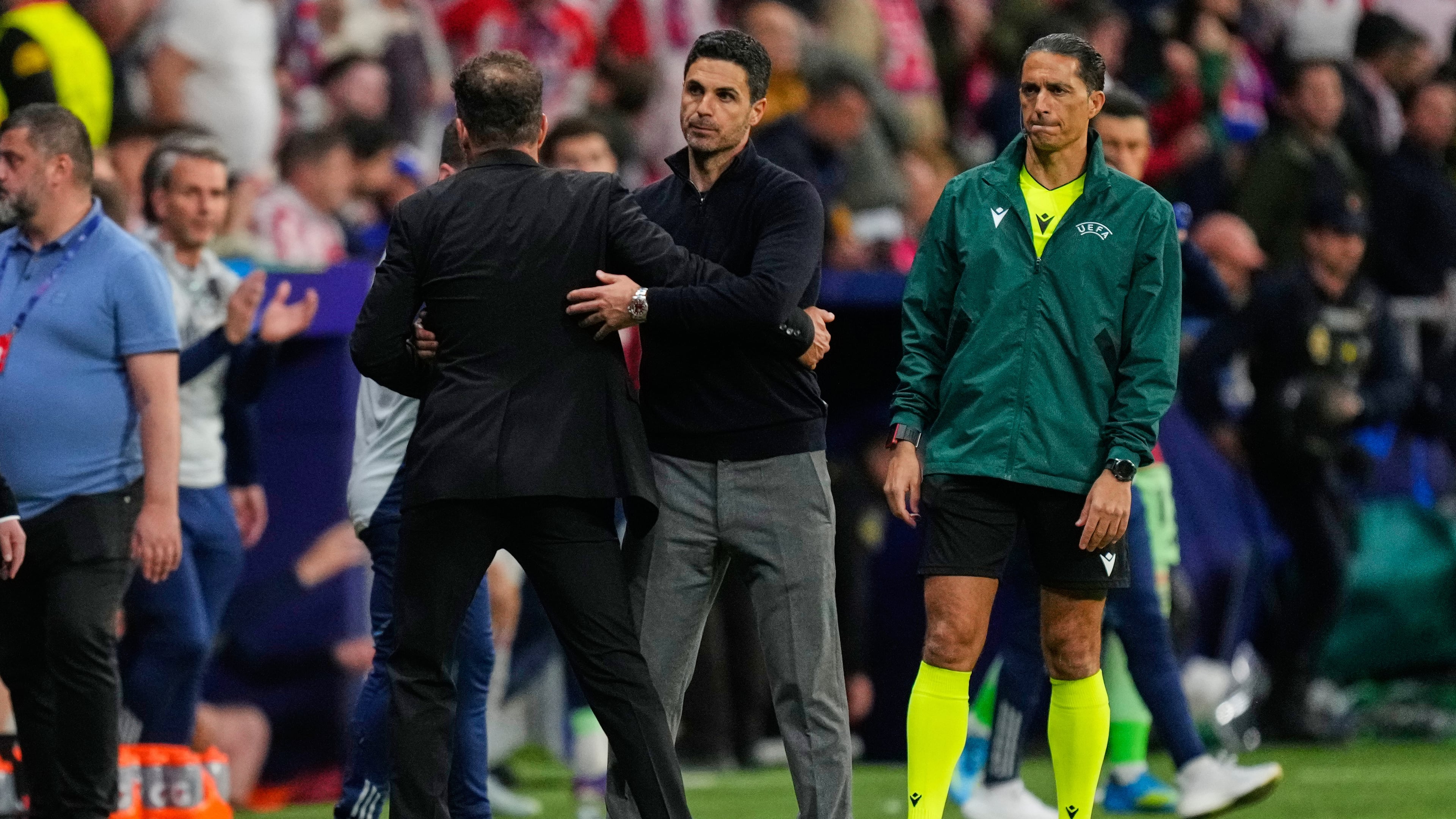 Atletico Madrid's head coach Diego Simeone, left, greets Arsenal's manager Mikel Arteta after a Champions League semifinal, first leg, soccer match between Atletico Madrid and Arsenal in Madrid, Spain, Wednesday, April 29, 2026. (AP Photo/Jose Breton)