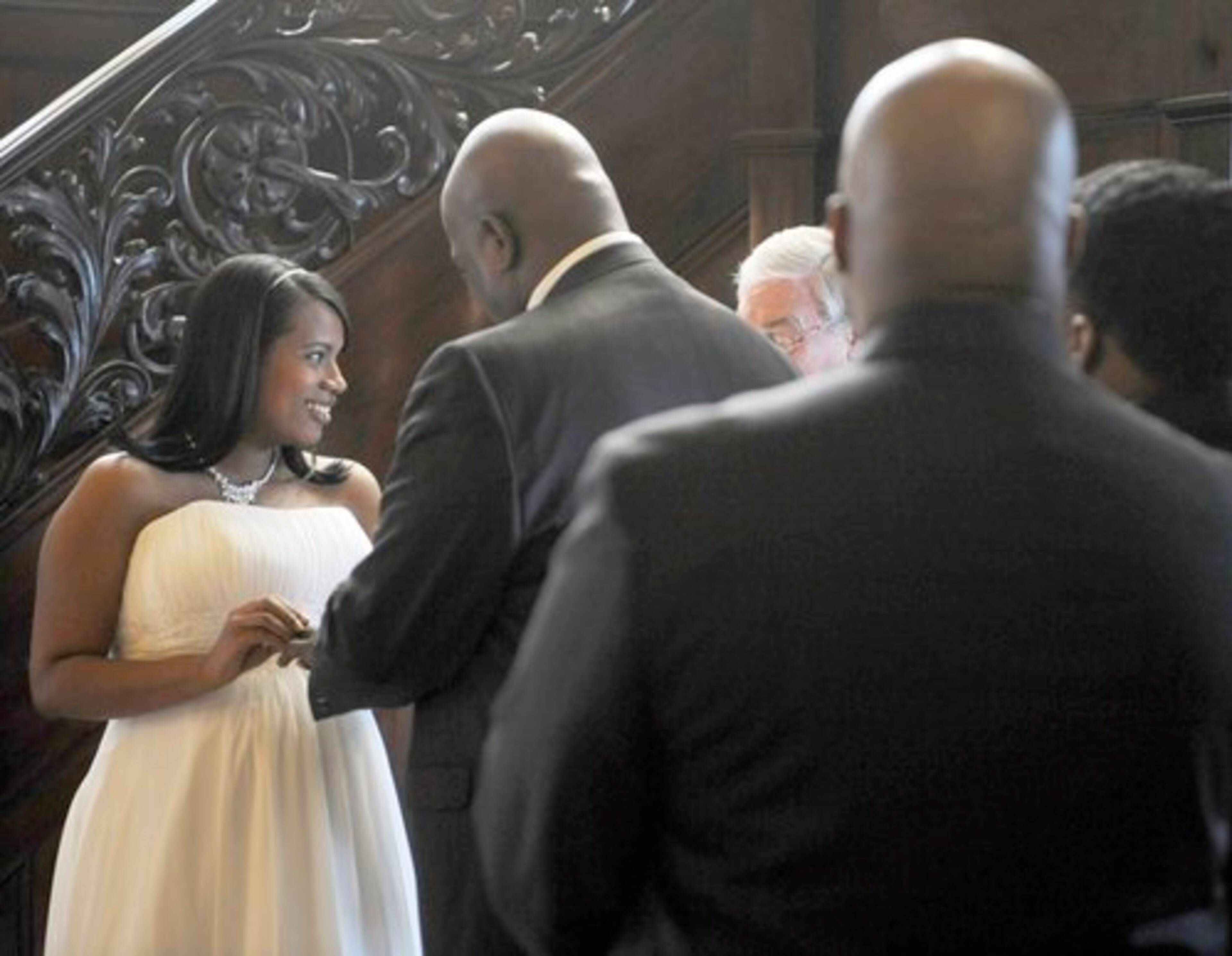 Sonnia Nunez places a wedding ring on her husband-to-be Noel Khalil. Nunez, who is from the Dominican Republic, met Khalil online two-and-a-half years ago.