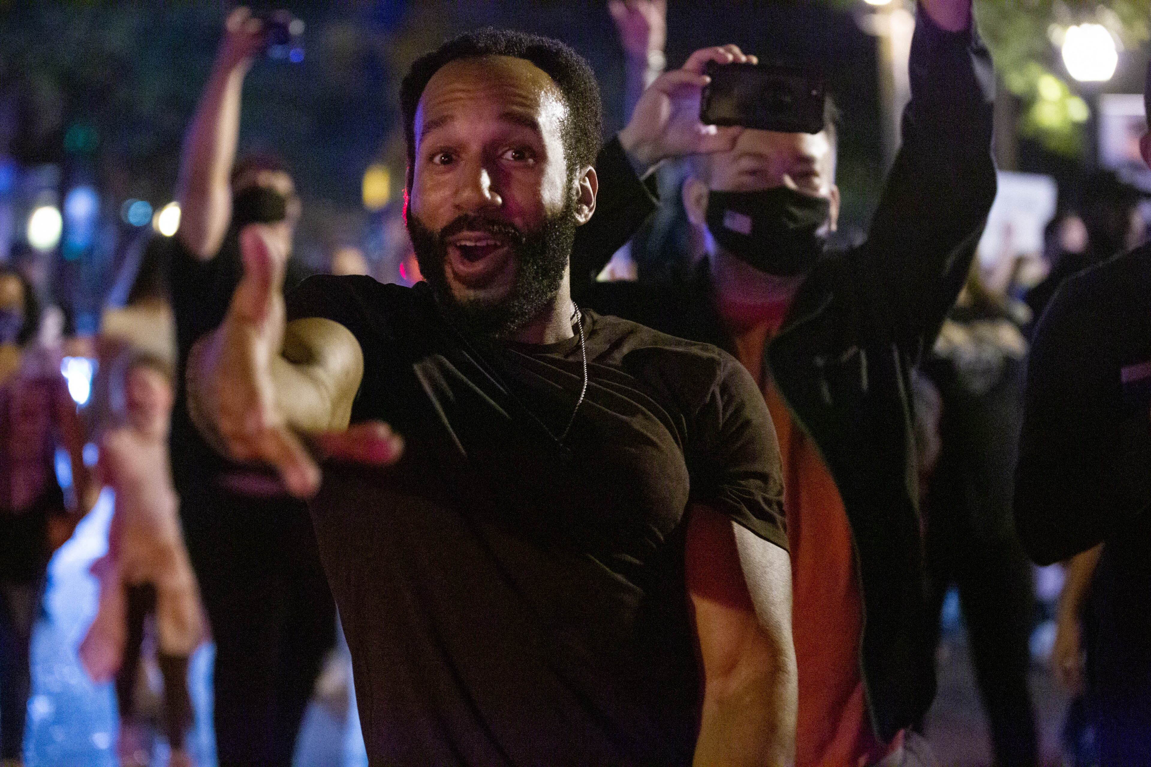 A man dances in the street to celebrate president-elect Joe Biden’s victory over Donald Trump in the United States general election in midtown Atlanta, on Saturday, November 7, 2020. (Rebecca Wright for the Atlanta Journa-Constitution)