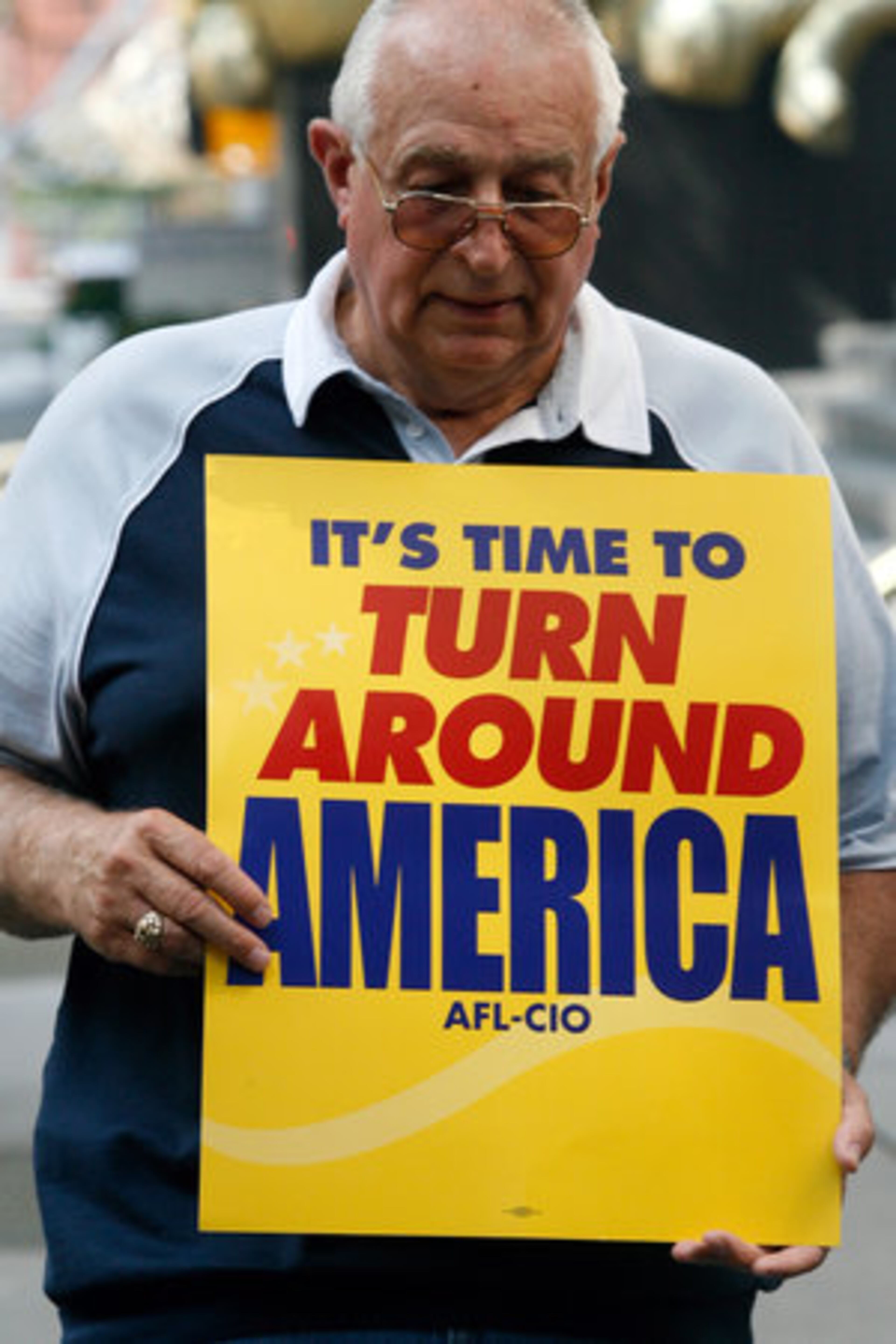 Ralph Meers, of the Graphic Communication Union, protests in front of the Marriott Marquis.