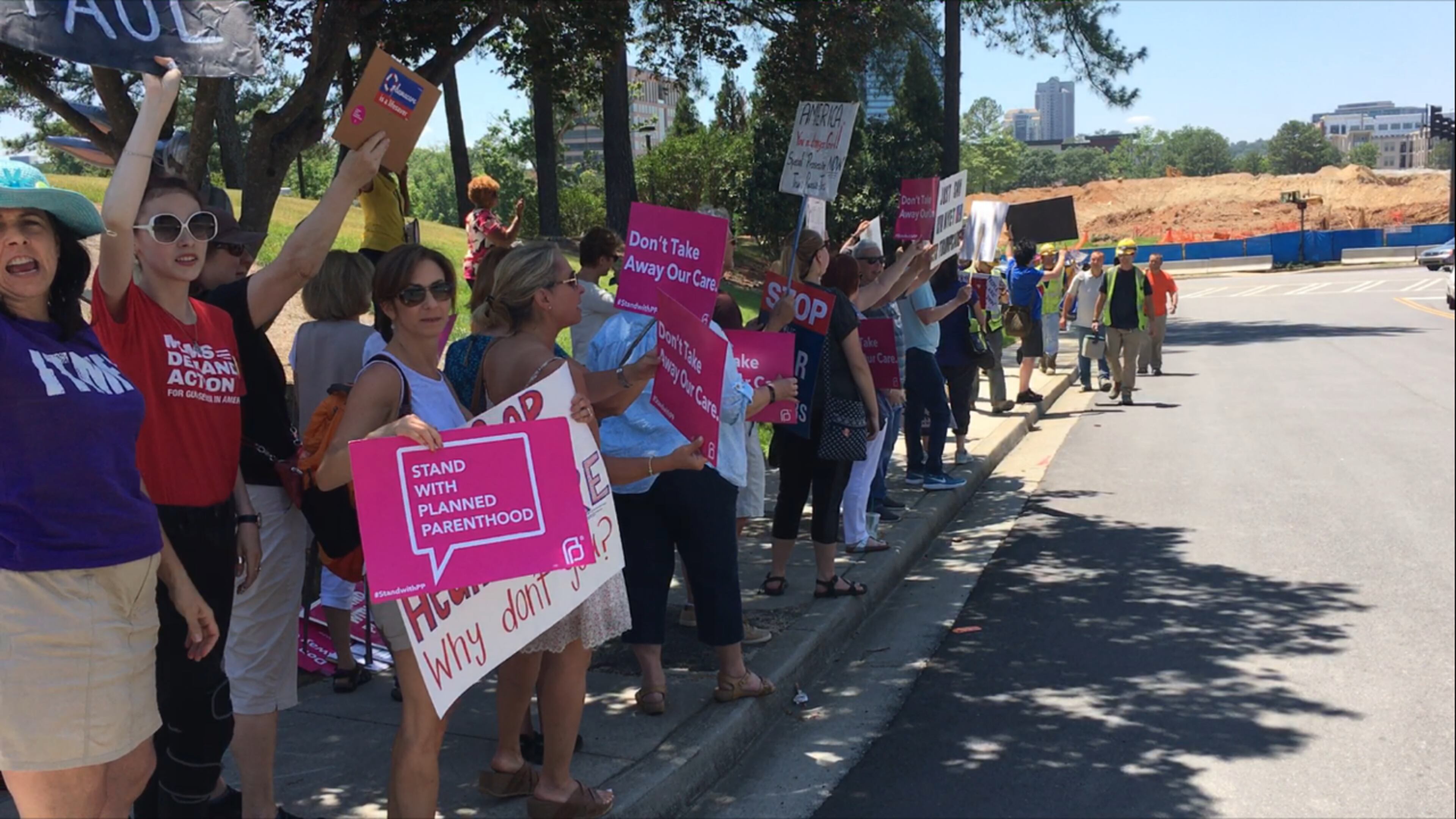 A few dozen protesters gather outside Paul Ryan's event in Georgia's 6th District. AJC/Greg Bluestein