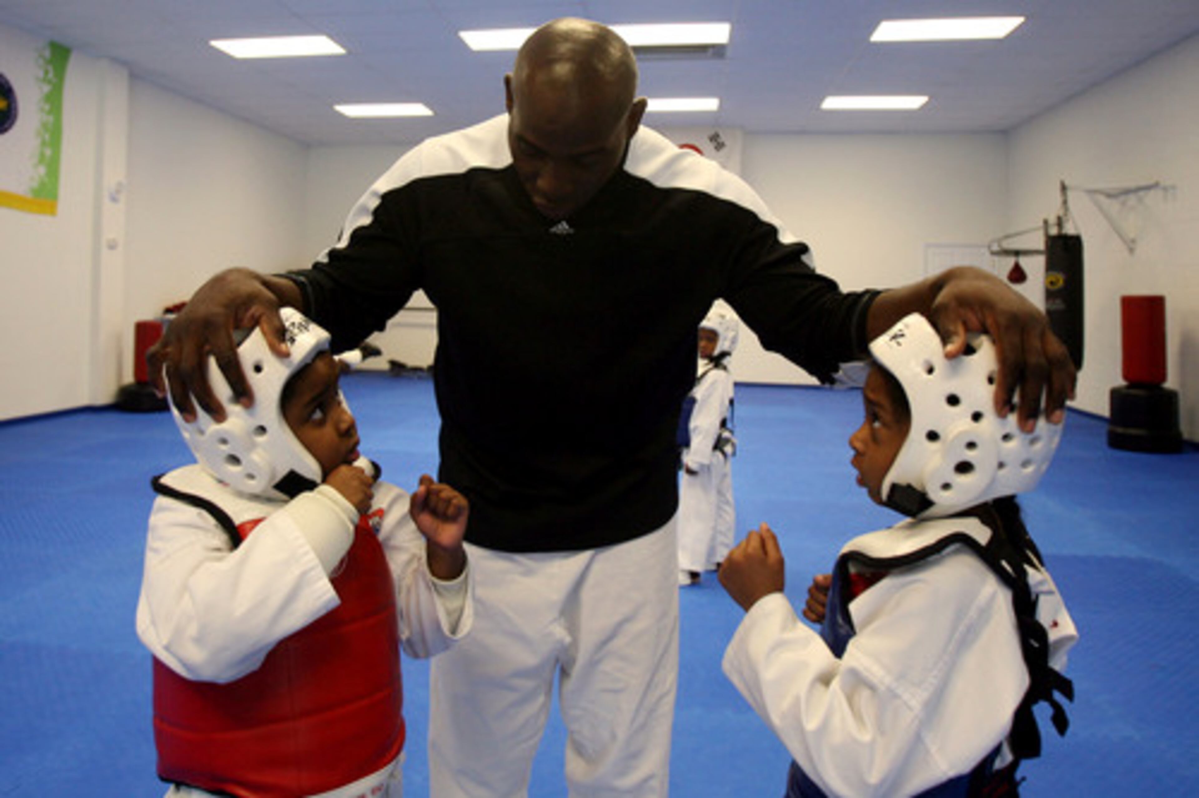 Lloyd gives direction to Tasia Greene, 7, left, and Jada Anderson, 6.