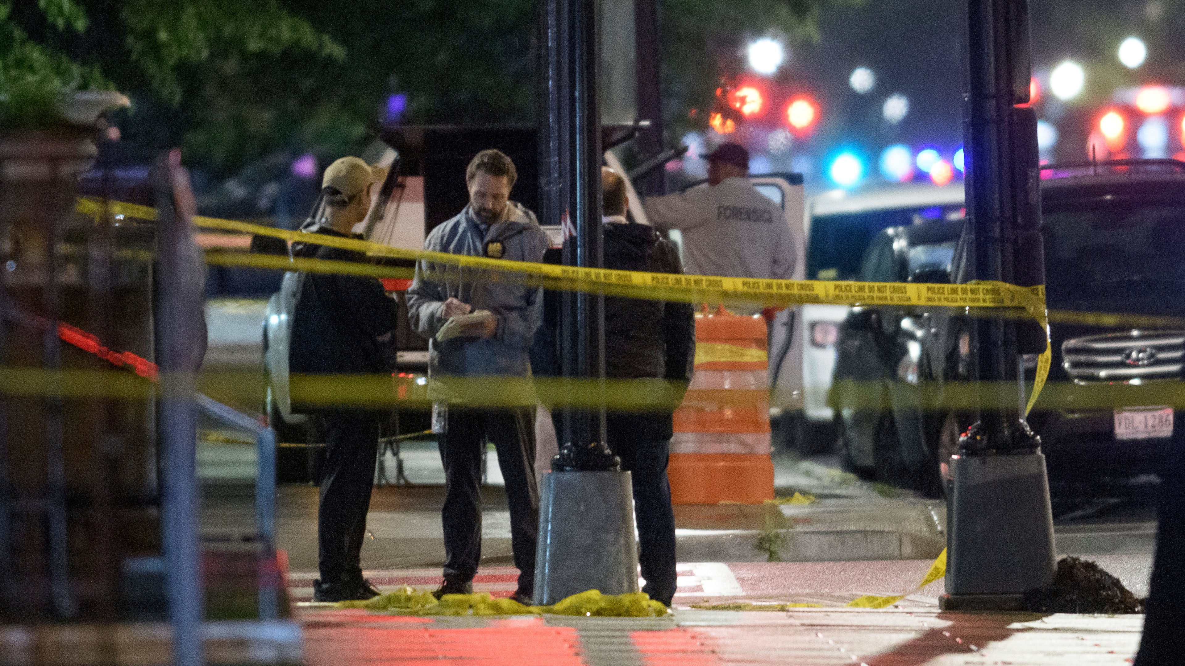 FILE - Law enforcement work the scene after two staff members of the Israeli Embassy in Washington were shot and killed outside the Capital Jewish Museum, May 22, 2025, in Washington. (AP Photo/Rod Lamkey, Jr., File)