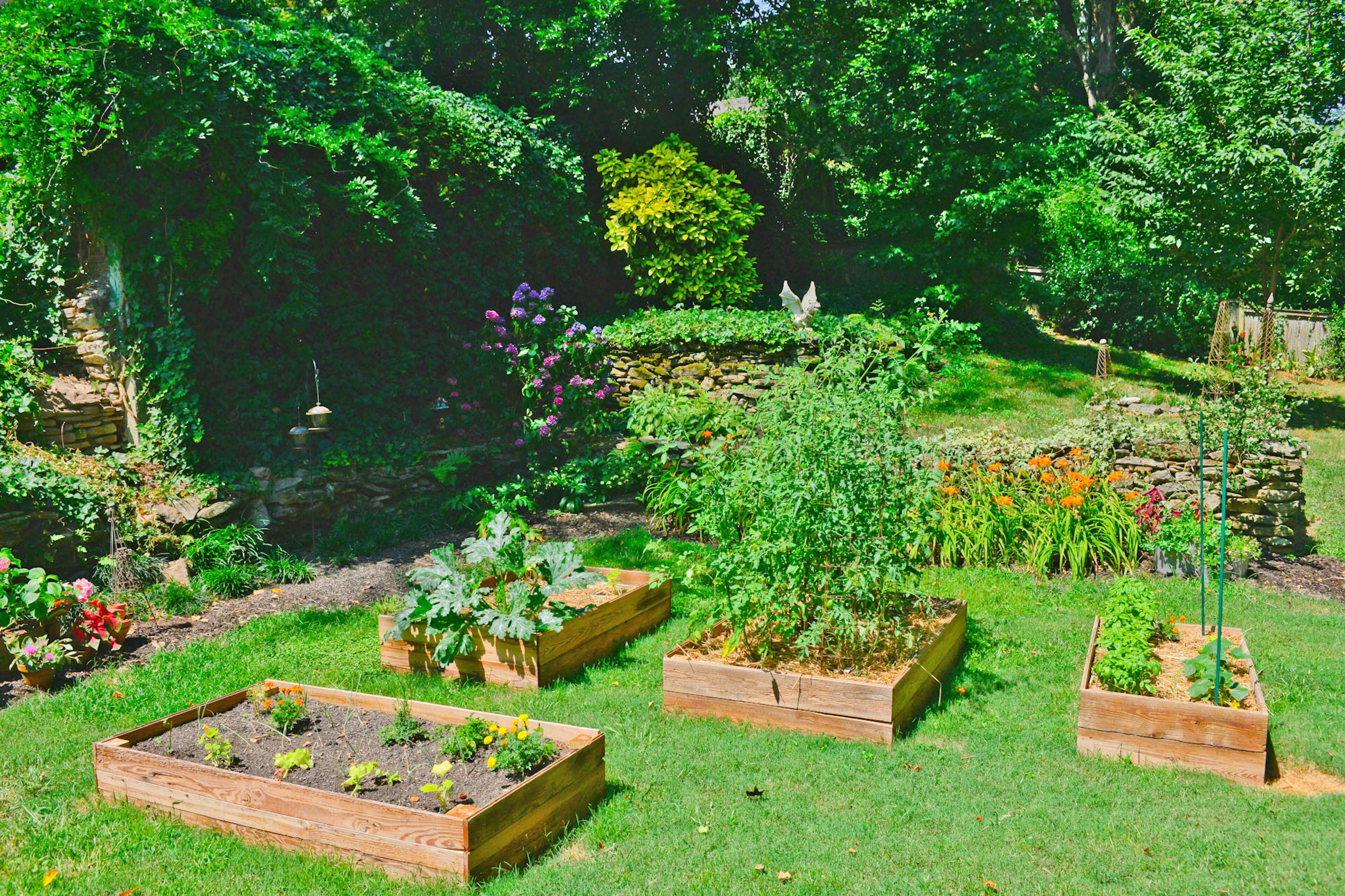 Birdfeeders welcome creatures to the Atlanta backyard, where the Moores rebuilt some of the stone walls that had crumbled and fallen down.