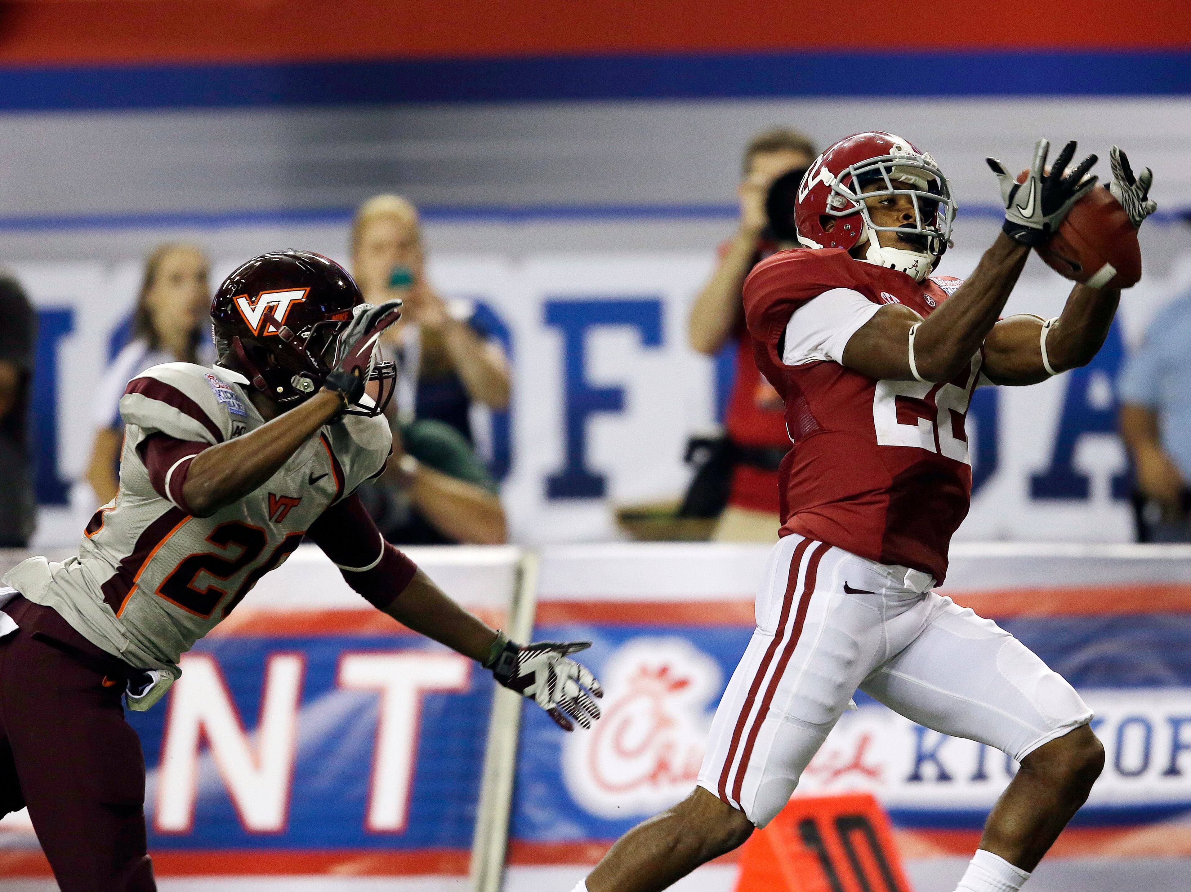 Alabama wide receiver Christion Jones (22) hauls in a pass for a touchdown as Virginia Tech fullback Fuller Hoepner (29) defends in the second half of an NCAA college football game, Saturday, Aug. 31, 2013, in Atlanta. (AP Photo/John Bazemore)