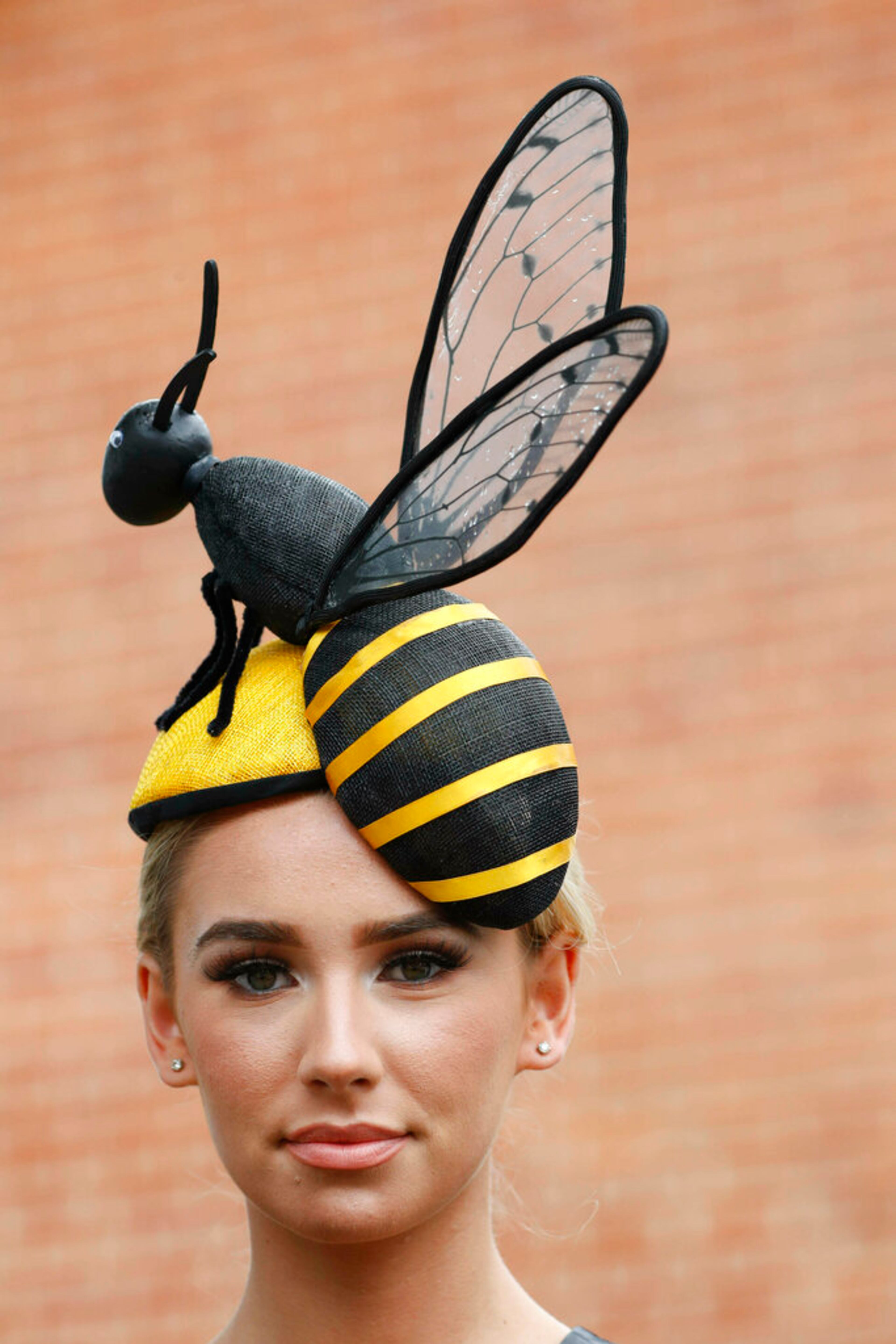 Ella Reese poses for photographers as she attends the day one of the annual Royal Ascot horse race meeting in Ascot, England, Tuesday, June 18, 2019. (AP Photo/Alastair Grant)