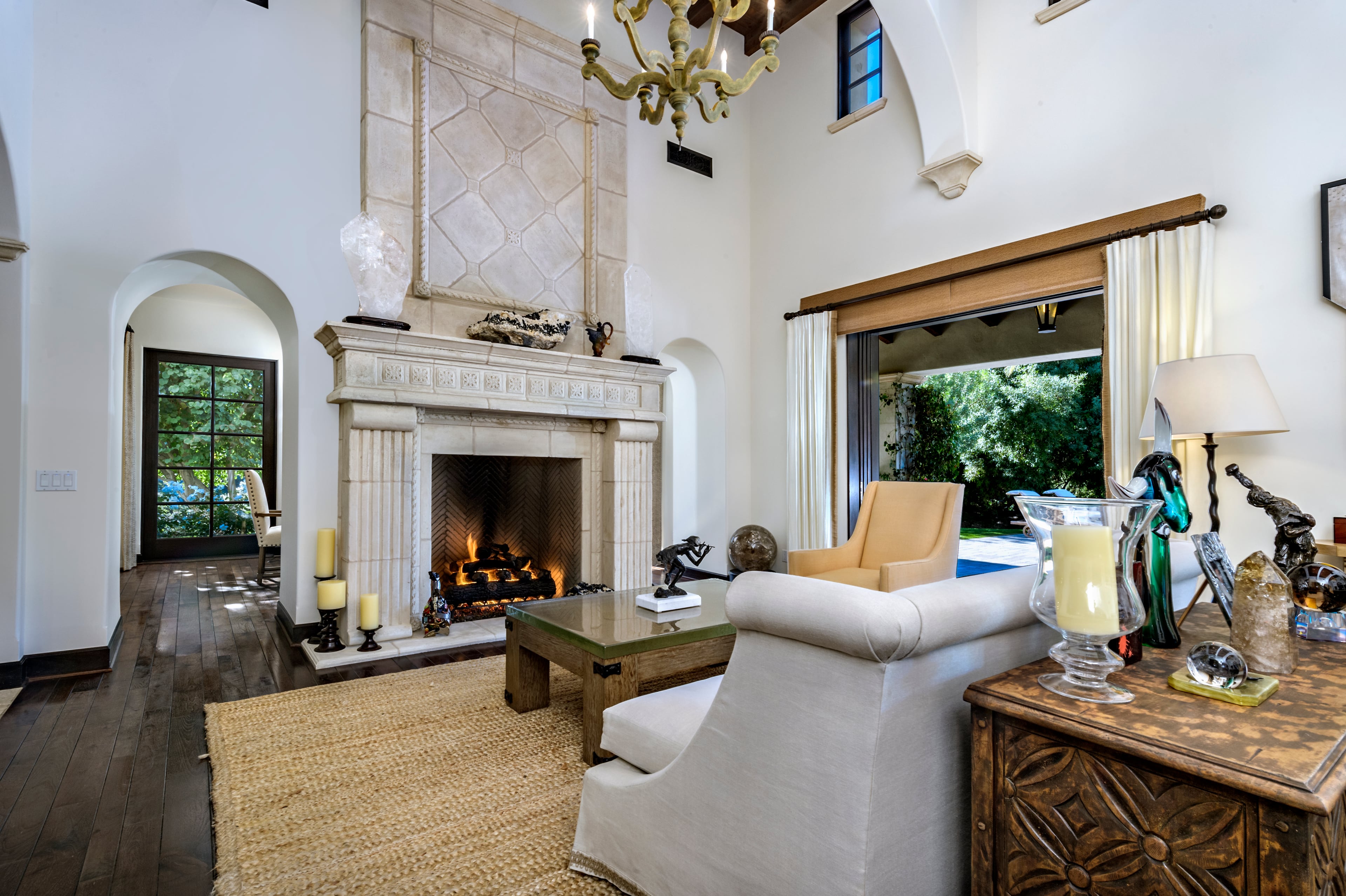 A stone fireplace is the focal point on one wall of the living room. Rocky star and all-around action movie legend Sylvester Stallone has put his desert home in a gated La Quinta, Calif., community up for sale at $4.2 million. The 5,173-square-foot, four-bedroom, 4.5-bathroom home features details such as arched doorways, exposed beams, and plenty of space to hang his paintings, since he’s not just an actor—he’s an artist, too. Listing courtesy of Josh Reef, Hurwitz James Company