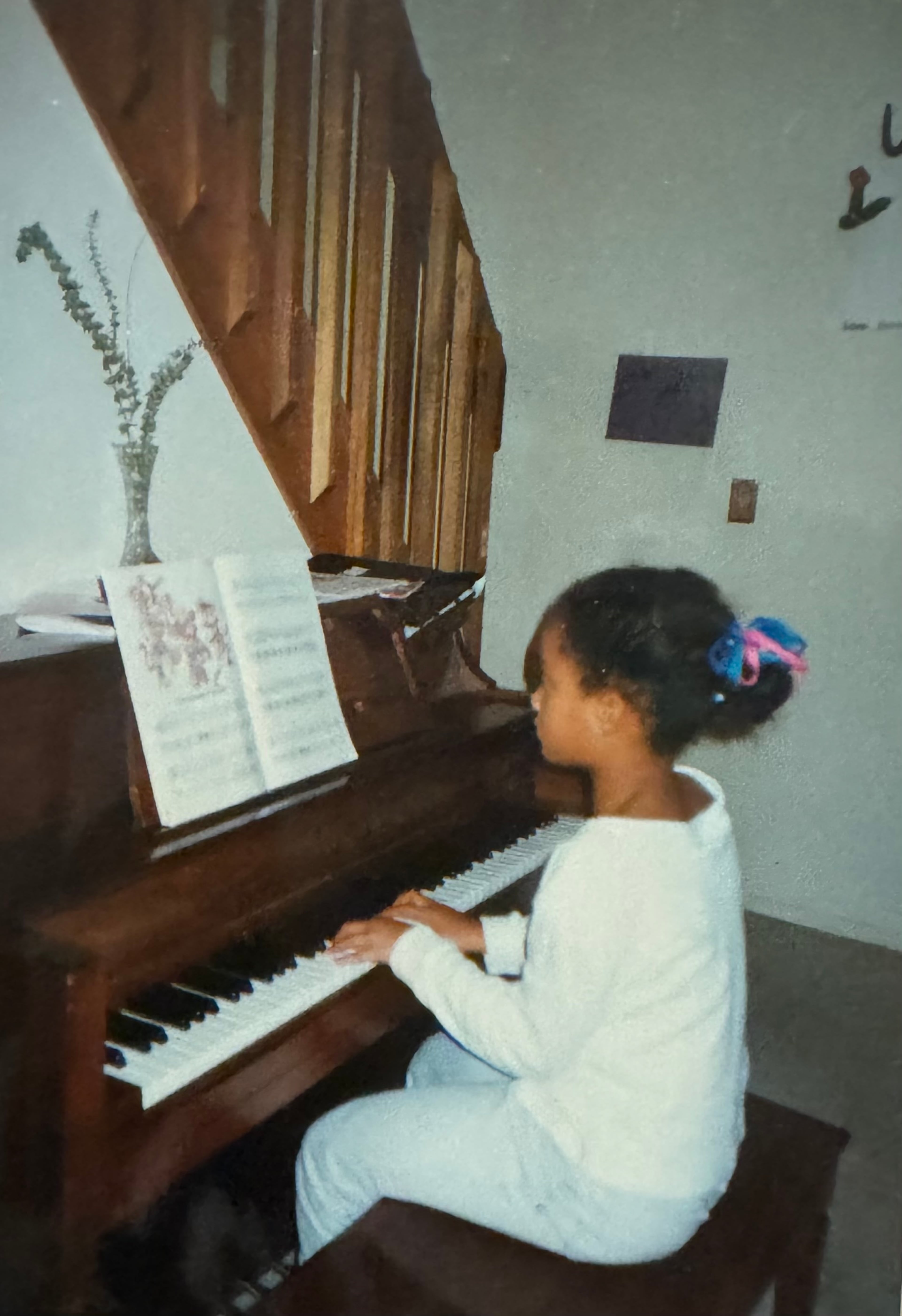 A young Brittney Boykin plays the piano. At the age of 36, Boykin has written about 50 compositions. (Courtesy)