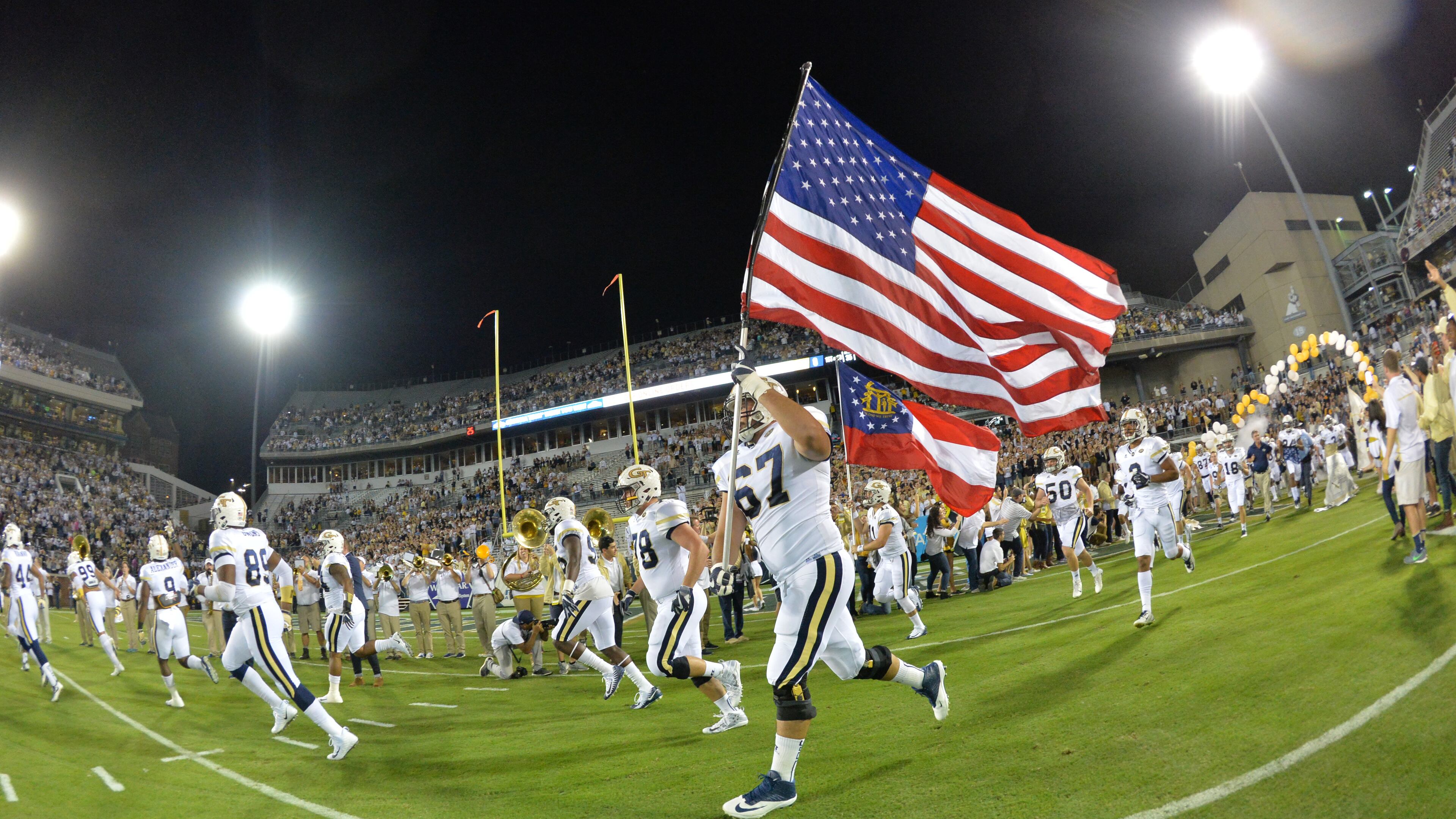 Georgia Tech's Ramblin' Wreck leads the band, cheerleaders, Buzz, players, and coaches before the start of the Georgia Tech home game against the Wake Forest during an NCAA college football game at Bobby Dodd Stadium on Saturday, October 21, 2017. HYOSUB SHIN / HSHIN@AJC.COM
