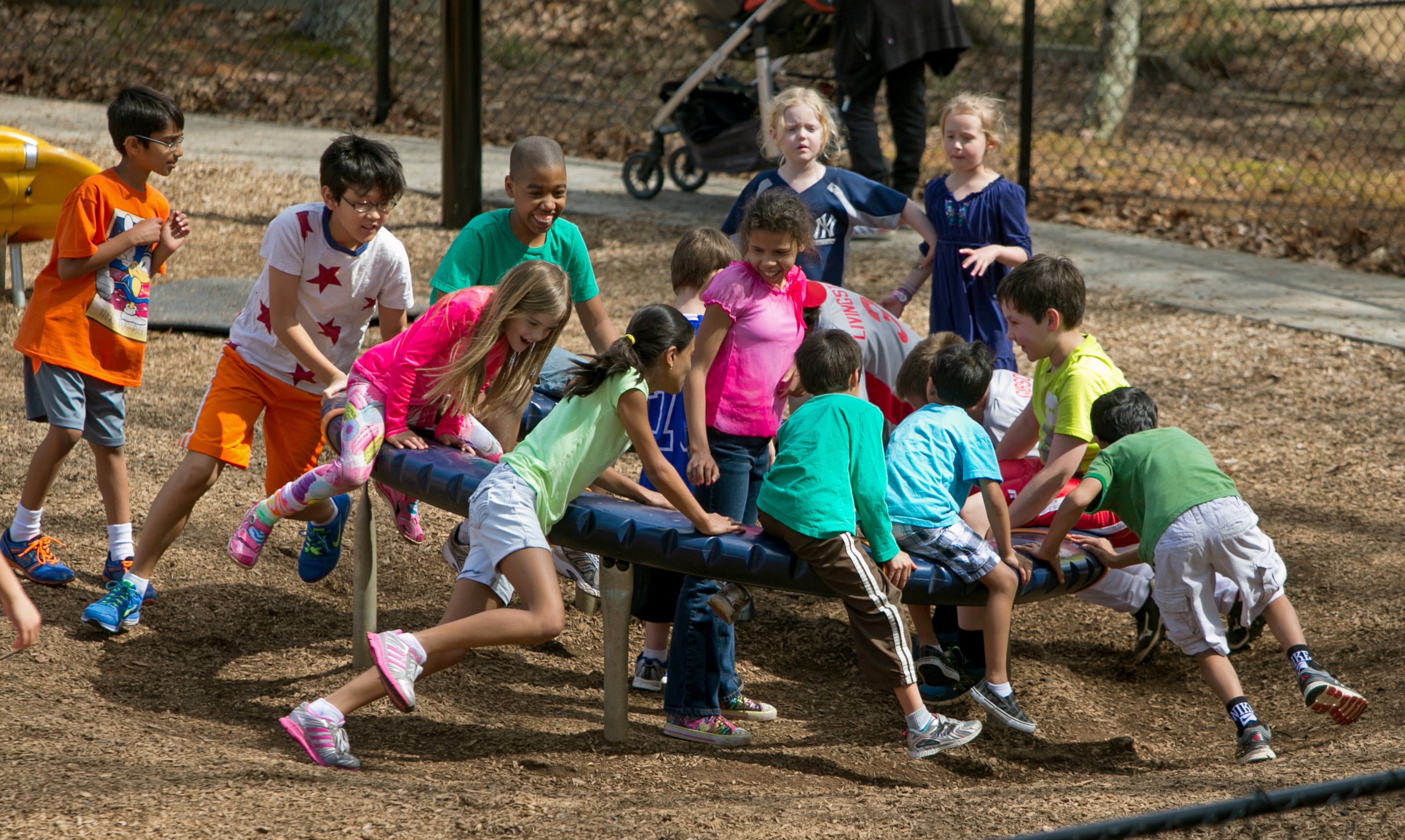 March 21, 2015 - Johns Creek, Ga: Many children play together at a playground at Newtown Park Saturday, March 21, 2015, in Johns Creek, Ga.. This is for a story on the Newtown community. PHOTO / JASON GETZ