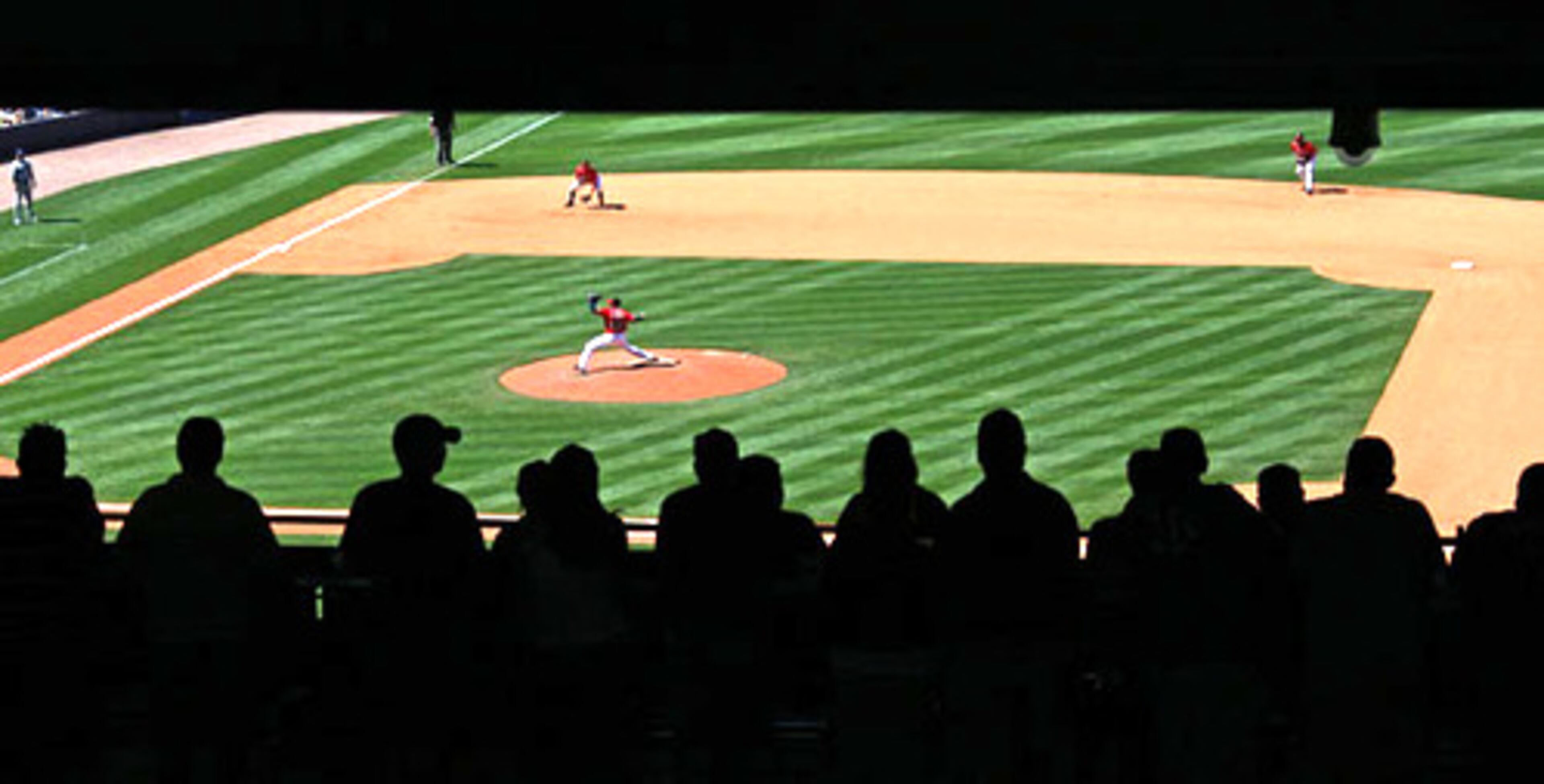 A Turner Field crowd watches Atlanta Braves starting pitcher Jair Jurrjens who had a stellar performance, allowing just three hits over seven innings, with one run, on Sunday. The team swept the Dodgers in their weekend series.