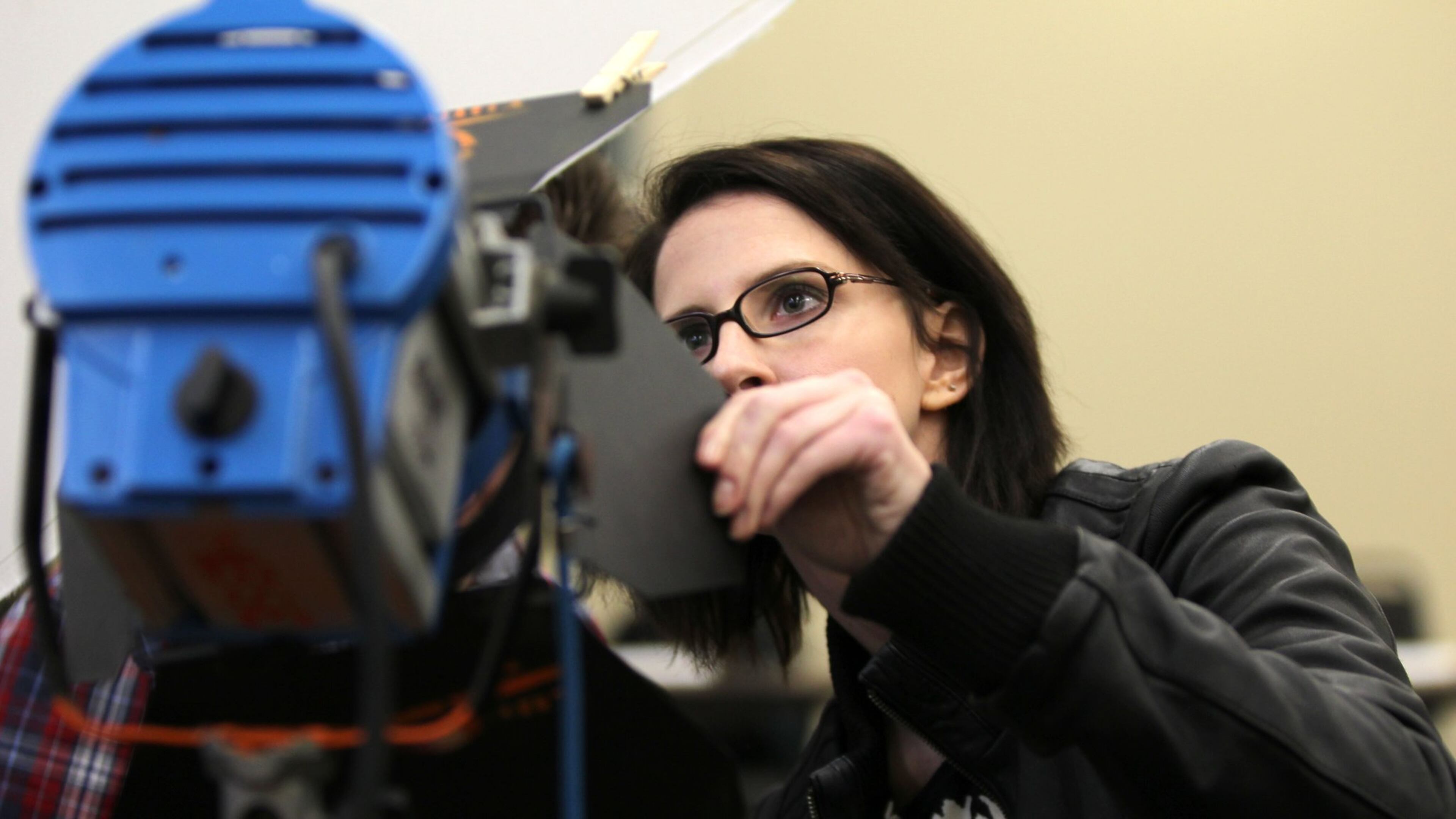Laura Hofer, 31, inspects a piece of lighting equipment during the on-set film production class at Gwinnett Technical College. The class is part of the Georgia Film Academy Certificate Program that will prepare students for on-set jobs in the film industry. TAYLOR CARPENTER / TAYLOR.CARPENTER@AJC.COM