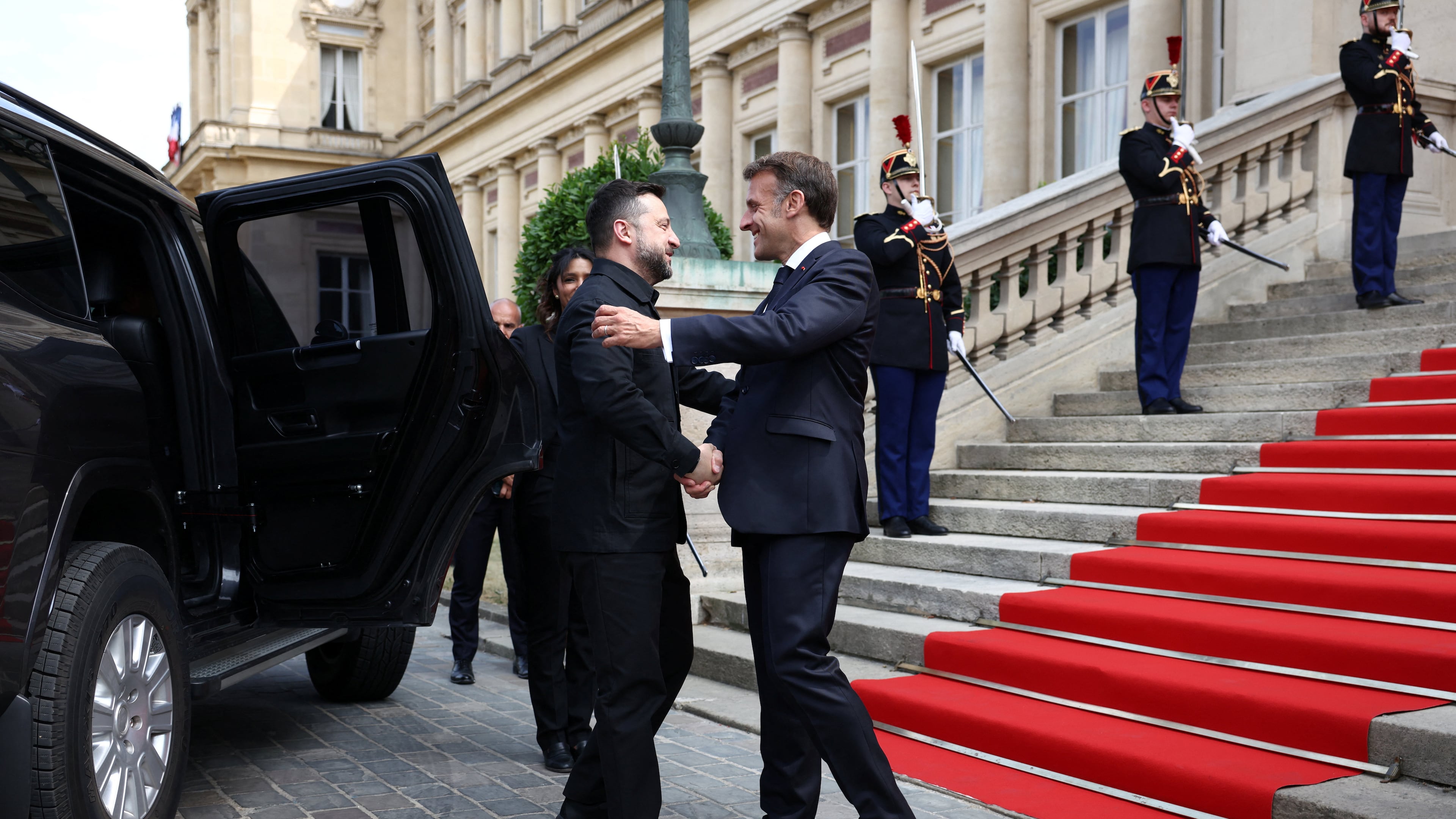 French President Emmanuel Macron, right, shakes hands with Ukrainian President Volodymyr Zelenskyy during a meeting in Paris, France, Mondy, July 13, 2026. (Tom Nicholson/Pool Photo via AP)