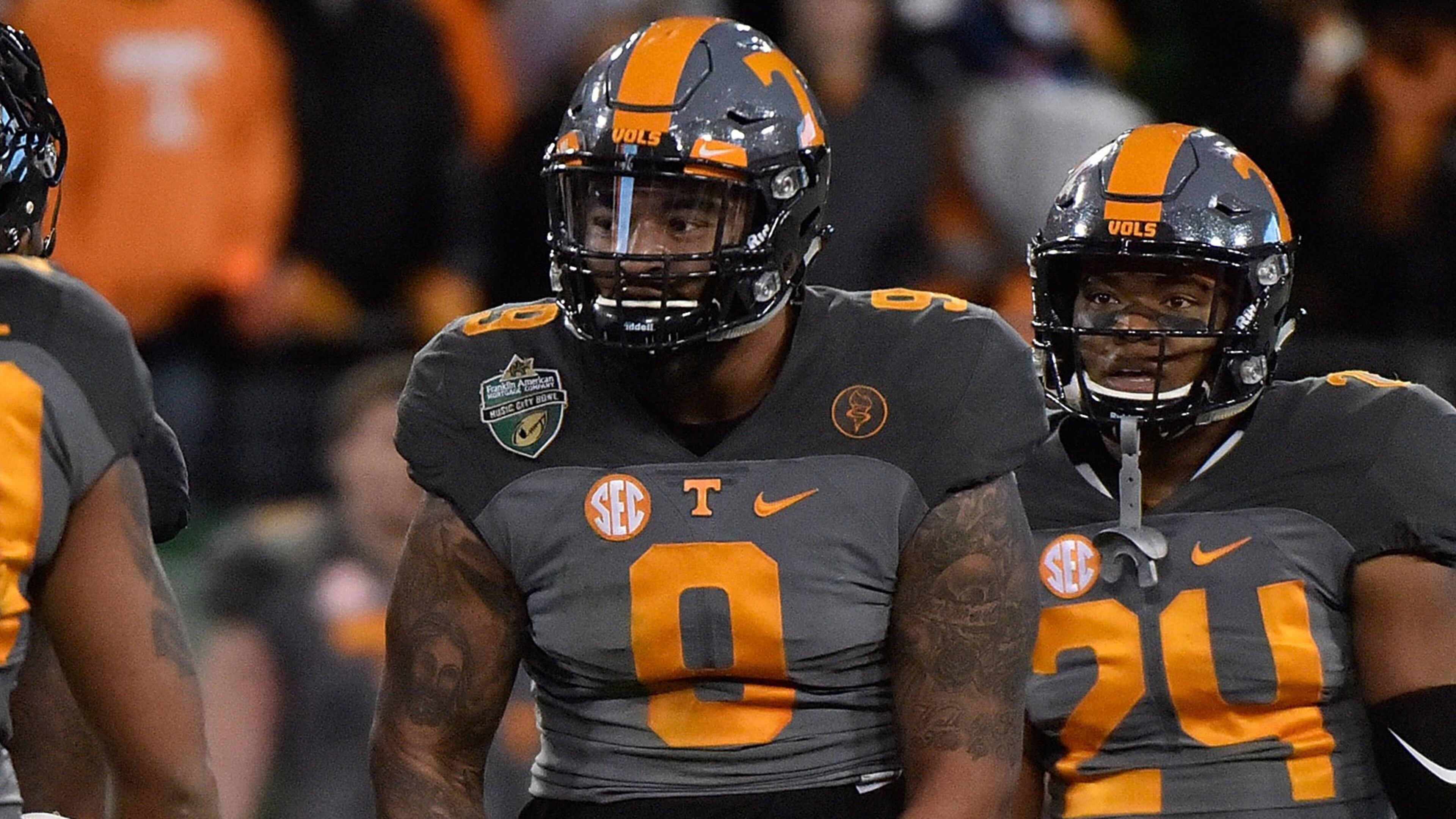 NASHVILLE, TN - DECEMBER 30: Derek Barnett #9 of the University of Tennessee Volunteers flexes after making his 33rd career sack, breaking the UT record held by Reggie White during the second half of the Franklin American Mortgage Music City Bowl at Nissan Stadium on December 30, 2016 in Nashville, Tennessee. (Photo by Frederick Breedon/Getty Images)