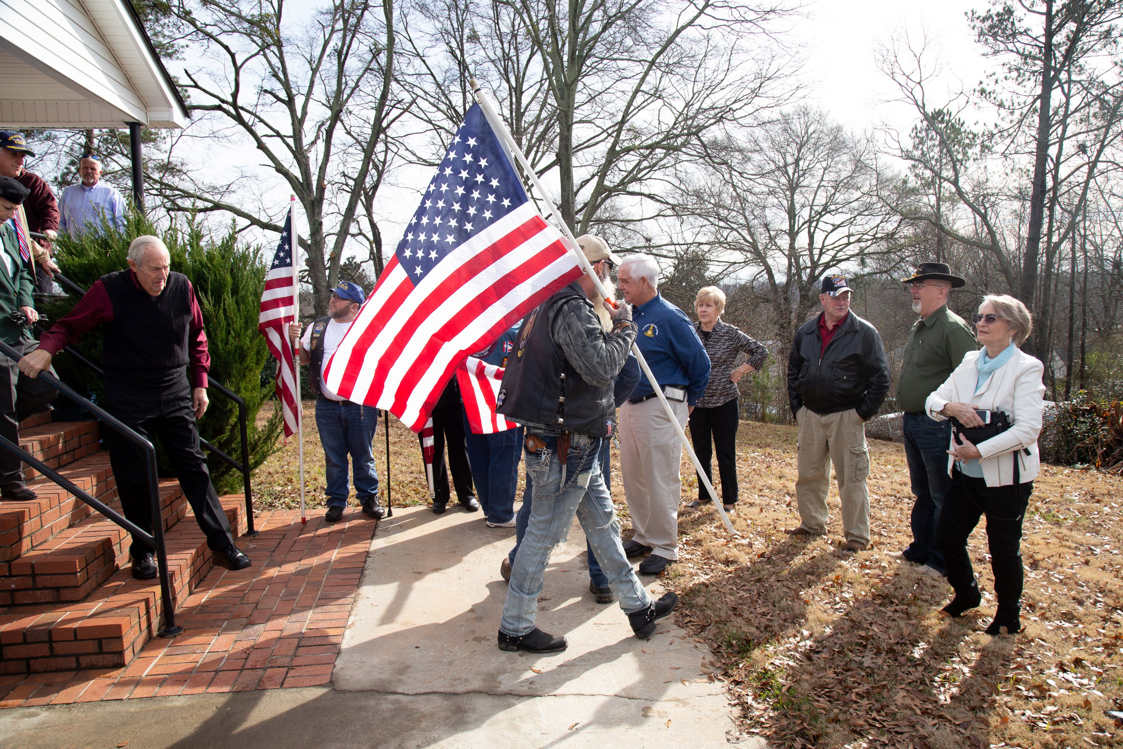 People gather around the Masonic Lodge in Flowery Branch before the start of the celebration of life ceremony for World War II veteran Pfc. Cornelius Cornelssen in Flowery Branch Saturday, December 29, 2018. Cornelssen, 93, passed away on December 17, 2018. STEVE SCHAEFER / SPECIAL TO THE AJC