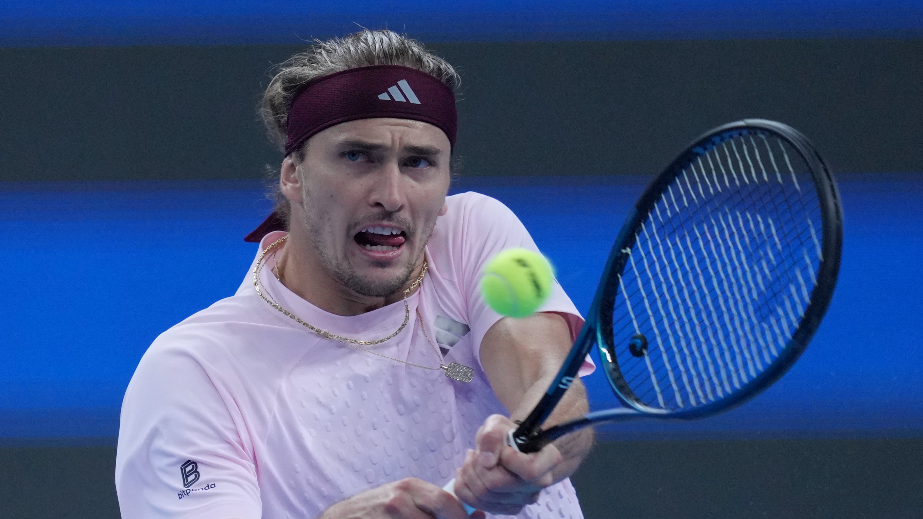 Alexander Zverev, of Germany, returns a ball to Novak Djokovic, of Serbia, during the men's singles quarterfinals match at the China Open tennis tournament in Beijing, Sunday, Oct. 4, 2026. (AP Photo/Achmad Ibrahim)
