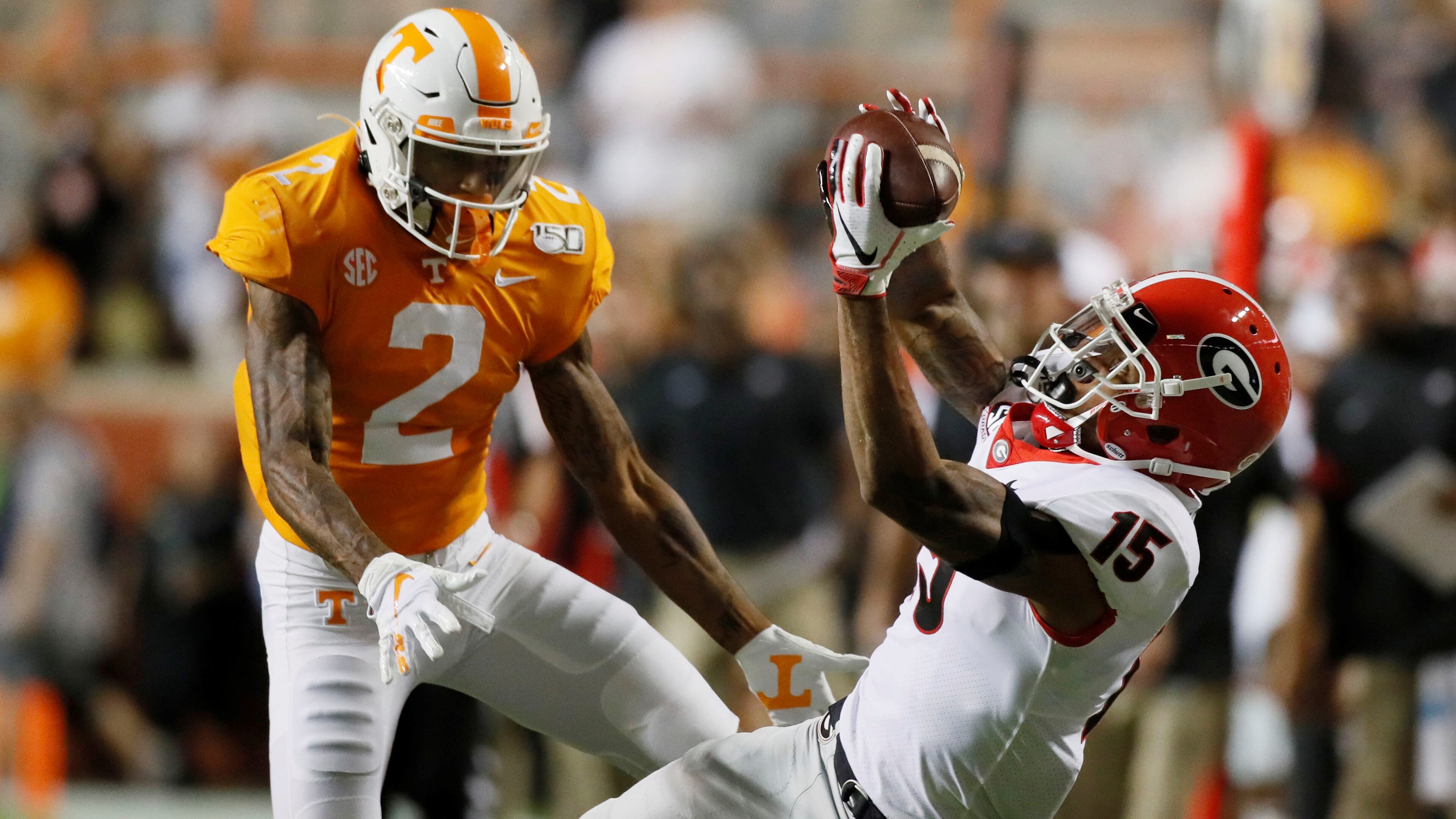 Georgia Bulldogs wide receiver Lawrence Cager (15) appeared to make a dramatic catch for a first down in the second quarter, defended by Tennessee Volunteers defensive back Alontae Taylor (2), but on review it was ruled incomplete during todays UGA vs Tennessee NCAA football game at Neyland Stadium in Knoxville. Bob Andres / robert.andres@ajc.com