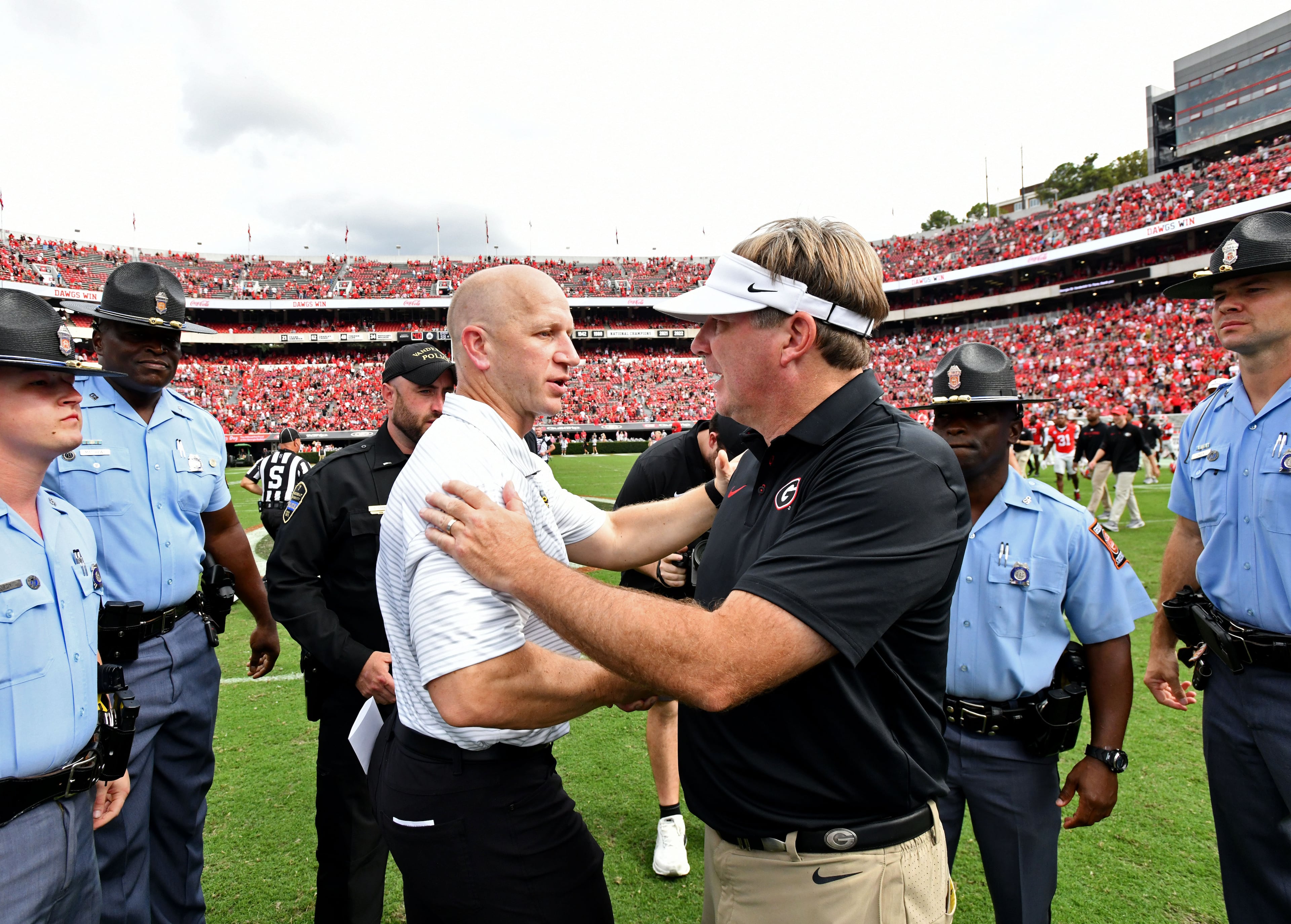 Vanderbilt head coach Clark Lea and Georgia head coach Kirby Smart shake hands after Georgia defeated Vanderbilt 38-14 during an NCAA football game at Sanford Stadium on Saturday, Oct. 3, 2026, in Athens. (Hyosub Shin/AJC)