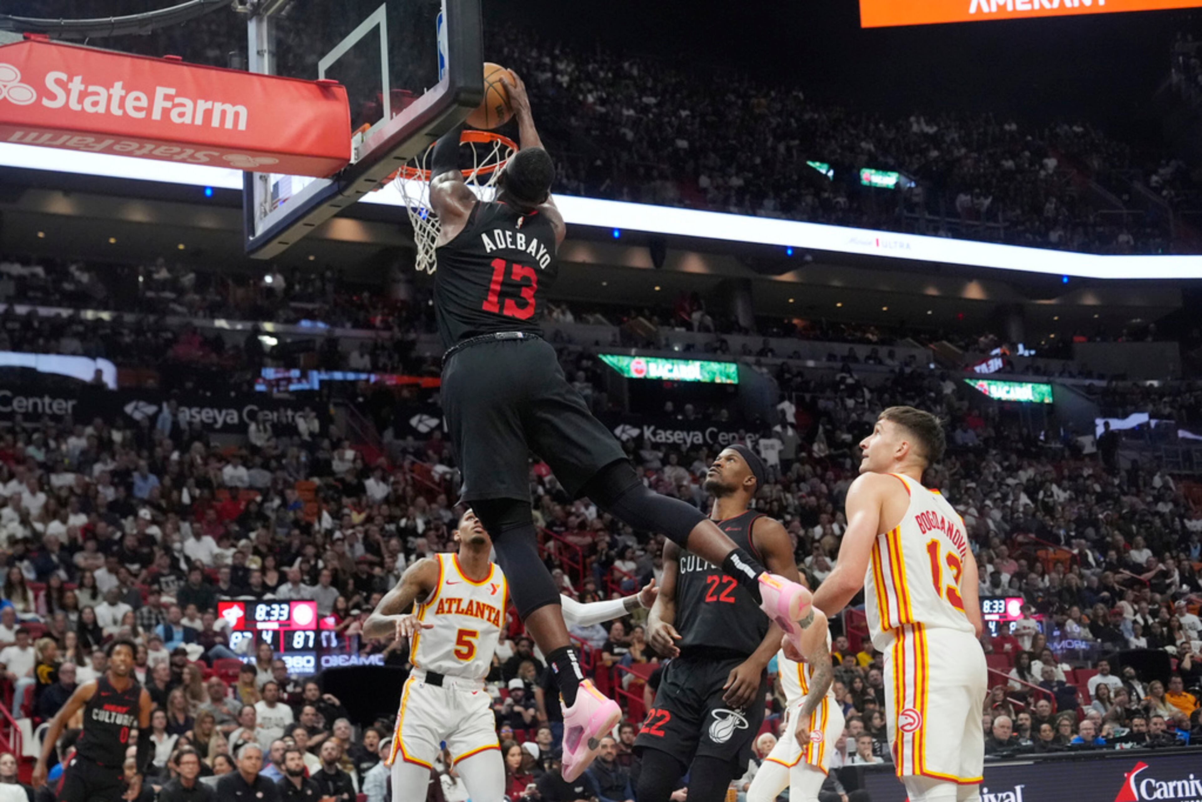 Miami Heat center Bam Adebayo (13) dunks the ball during the second half of an NBA basketball game Atlanta Hawks, Friday, Jan. 19, 2024, in Miami. (AP Photo/Marta Lavandier)