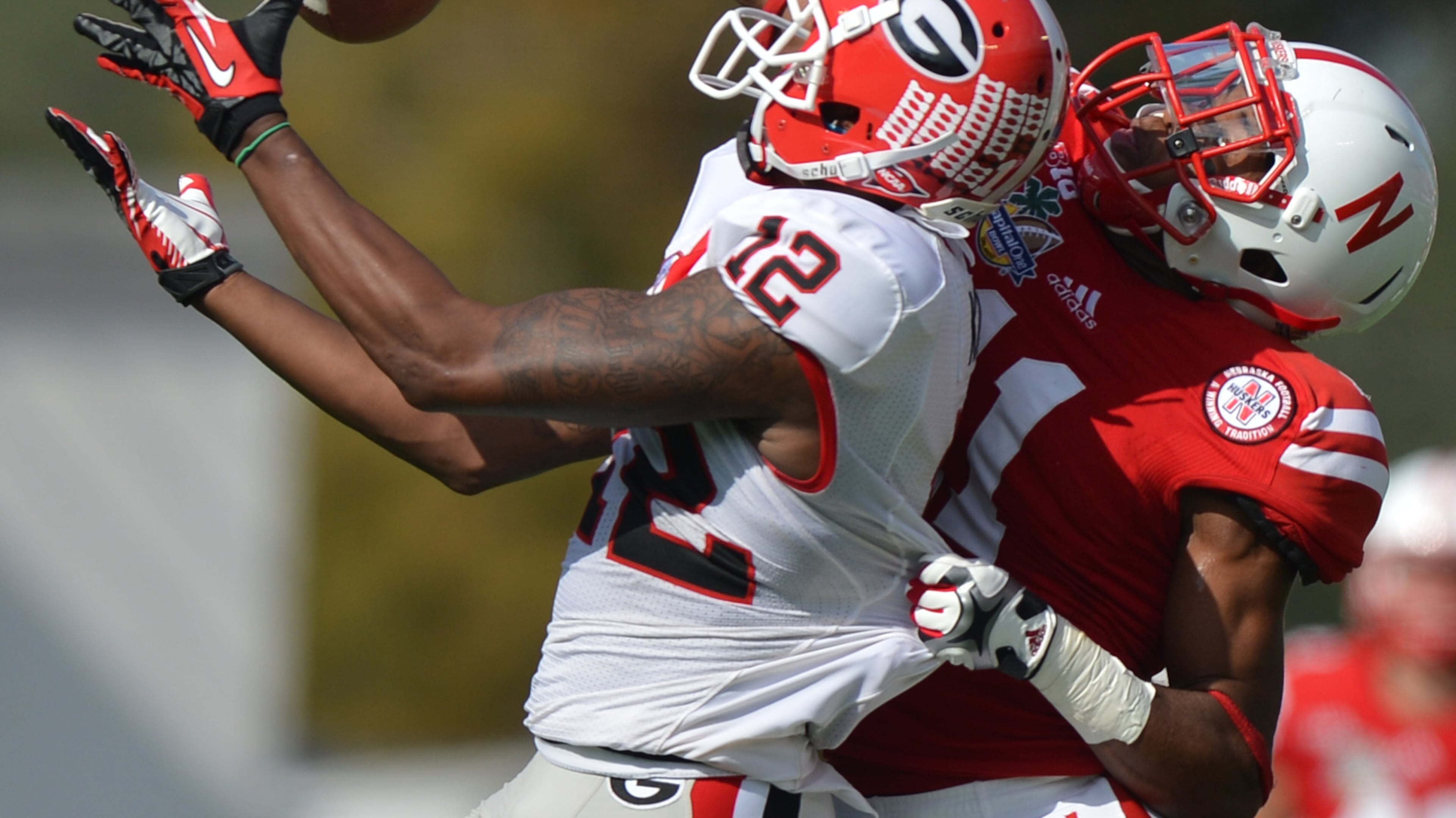 January 1, 2013 Orlando, FL: Georgia Bulldogs wide receiver Tavarres King hauls in a Aaron Murray pass for a 75 yard touchdown in front of Nebraska Cornhuskers cornerback Andrew Green during the first quarter of the Capital One Bowl in Orlando Tuesday January 1, 2013. BRANT SANDERLIN / BSANDERLIN@AJC.COM