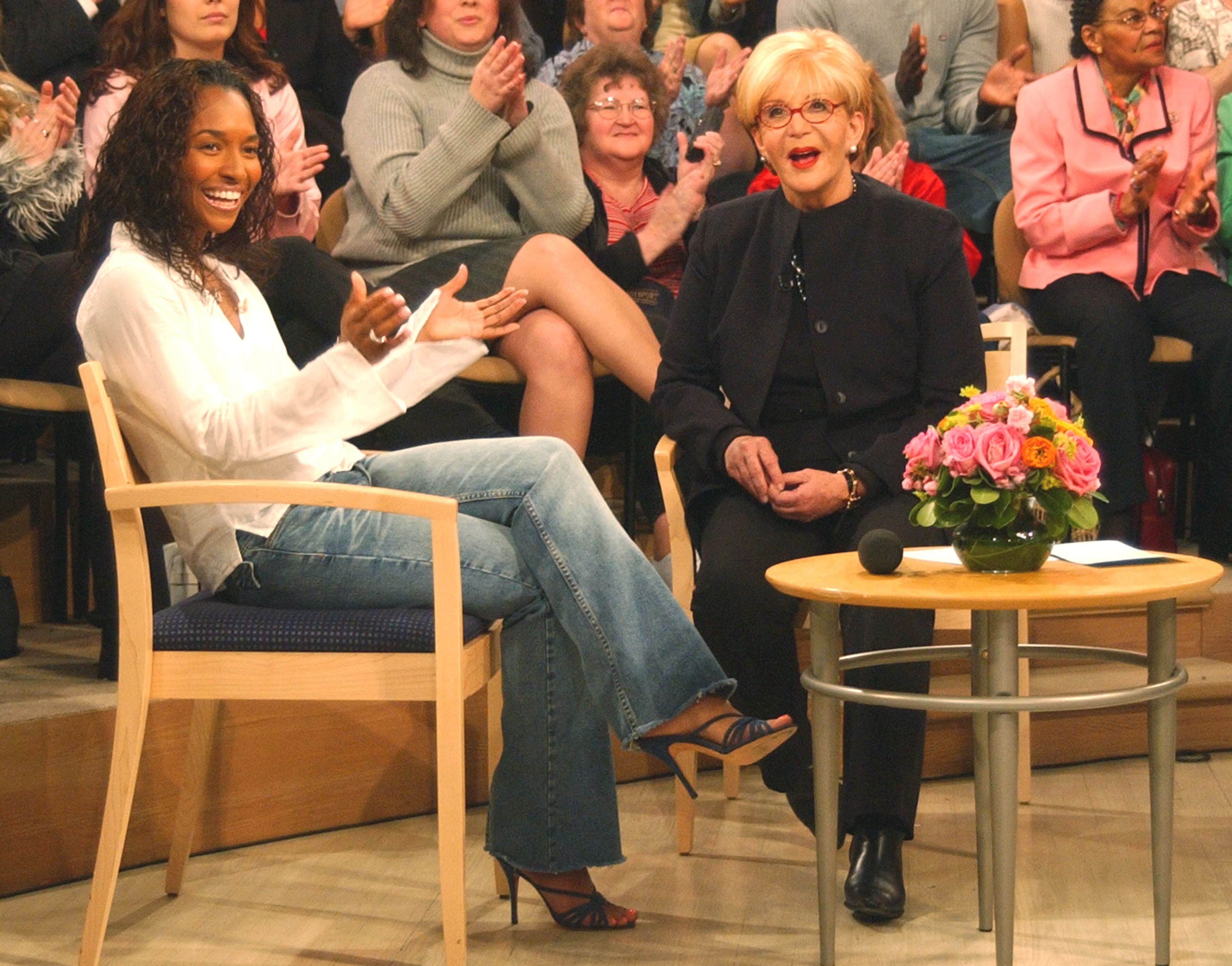 404446 03: Talk show host Sally Jesse Raphael (R) speaks with her guest, singer Chilli from the group TLC during the taping of her last show April 24, 2002 in New York City. Raphael's last show will air this May. (Photo by Jim Lord/Getty Images)