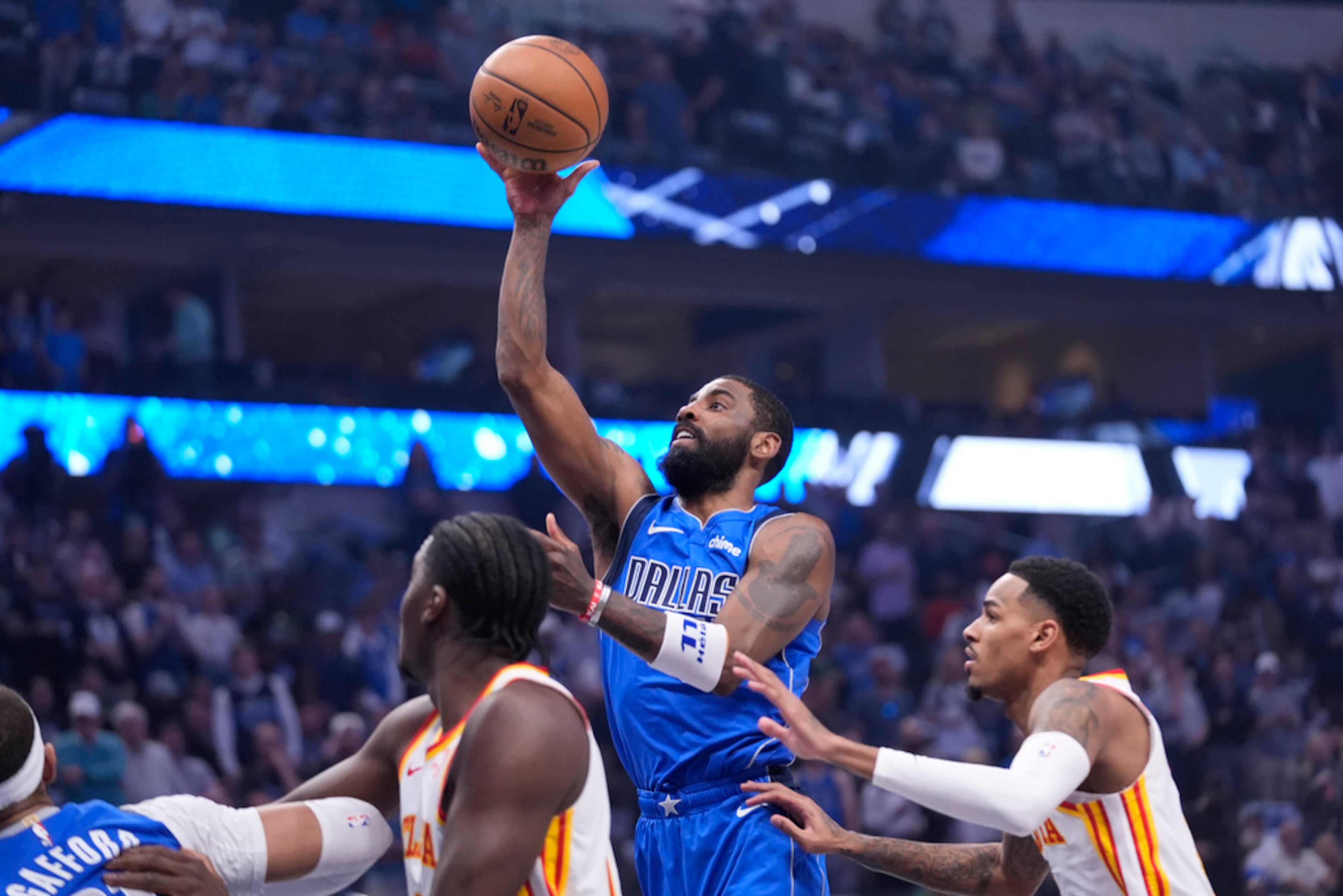 Dallas Mavericks guard Kyrie Irving (11) shoots during the first half of an NBA basketball game against the Atlanta Hawks in Dallas, Thursday, April 4, 2024. (AP Photo/LM Otero)