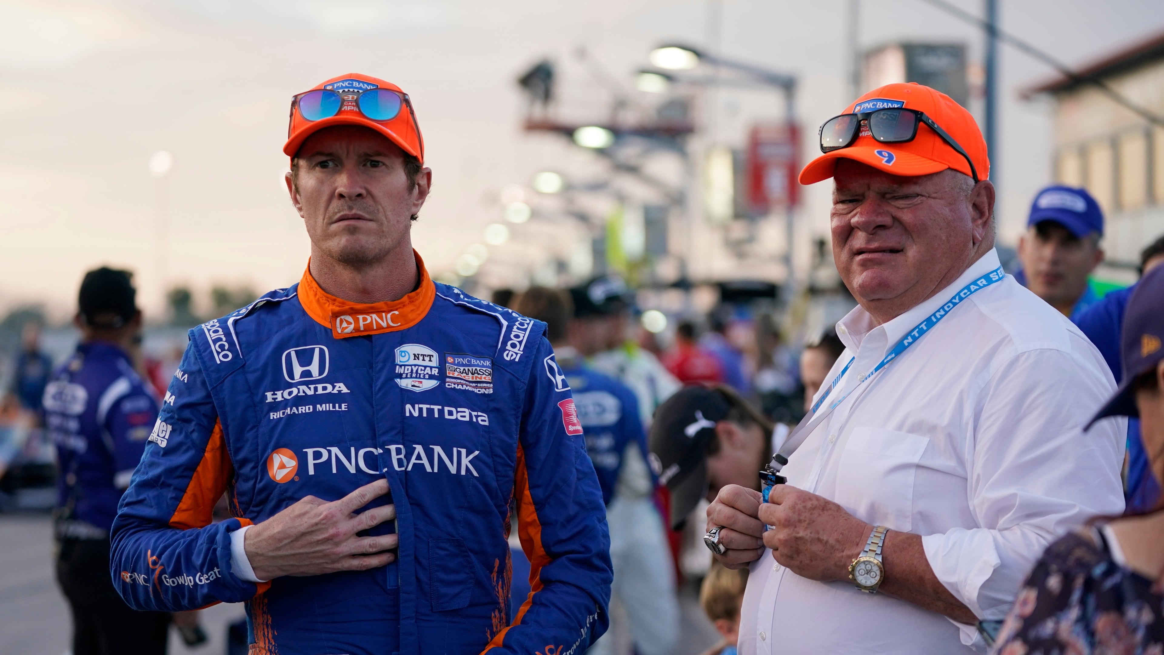 FILE - Scott Dixon, left, stands next to Chip Ganassi before the start an IndyCar auto race at World Wide Technology Raceway on Aug. 21, 2021, in Madison, Ill. (AP Photo/Jeff Roberson, File)