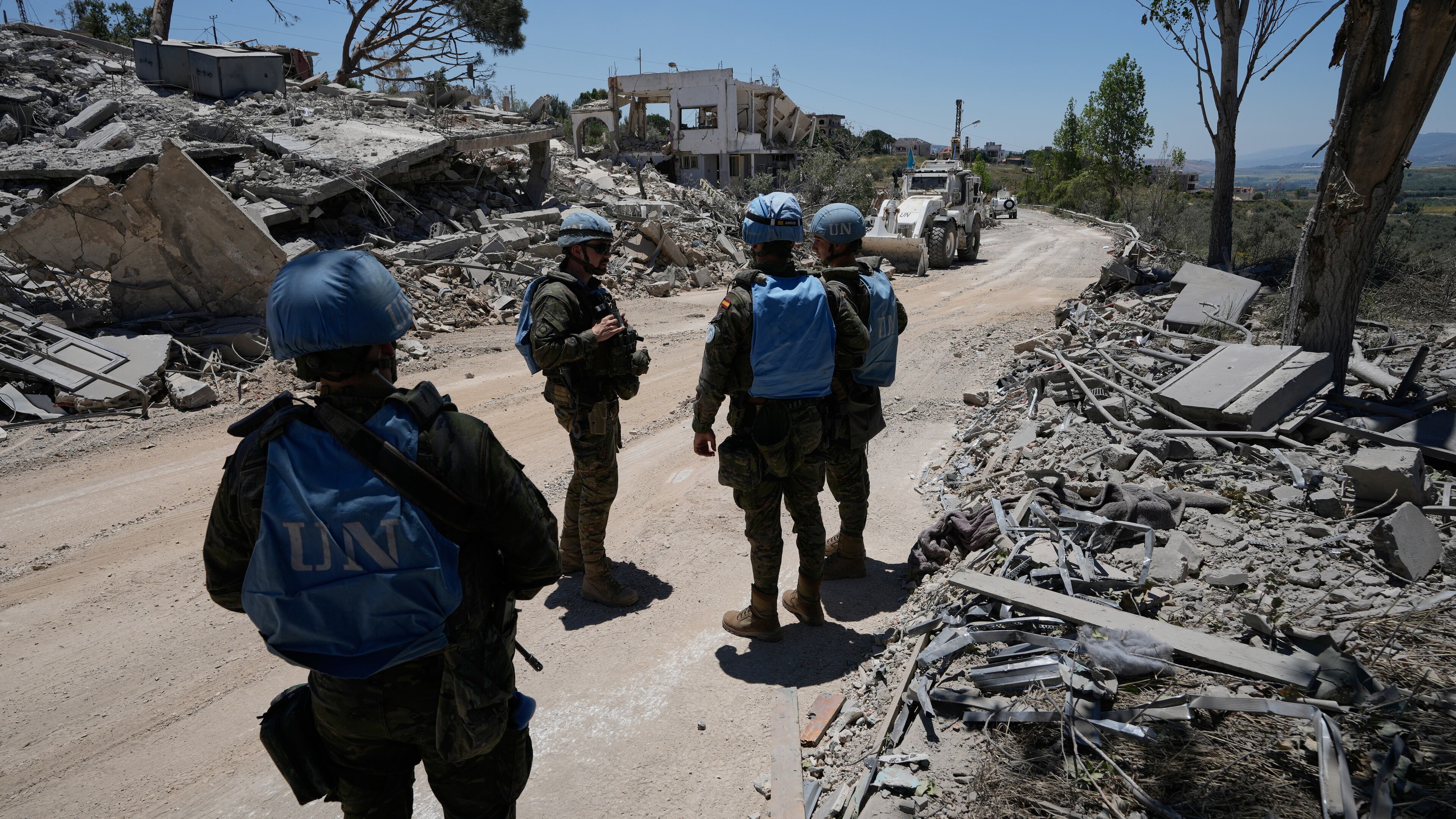 Spanish U.N peacekeepers deploy at a road in Dibbine village, southeast Lebanon, Friday, June 5, 2026, a day after Israeli forces withdrew following intense clashes with Hezbollah fighters. (AP Photo/Hussein Malla)