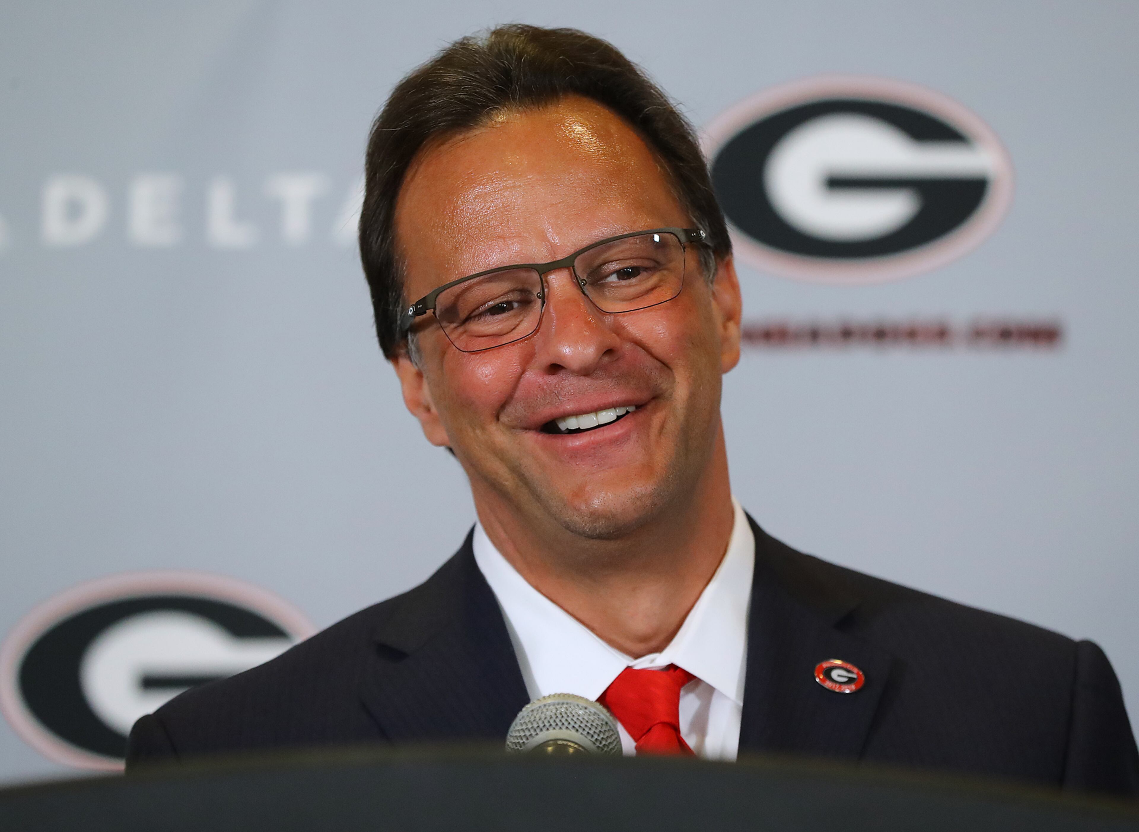 March 16, 2018 Athens: Tom Crean is all smiles while being introduced as the new men's basketball head coach at the University of Georgia on Friday, March 16, 2018, at Stegeman Coliseum in Athens. Crean compiled a 356-231 record in 18 seasons at Marquette and Indiana from 1999-2017. Curtis Compton/ccompton@ajc.com