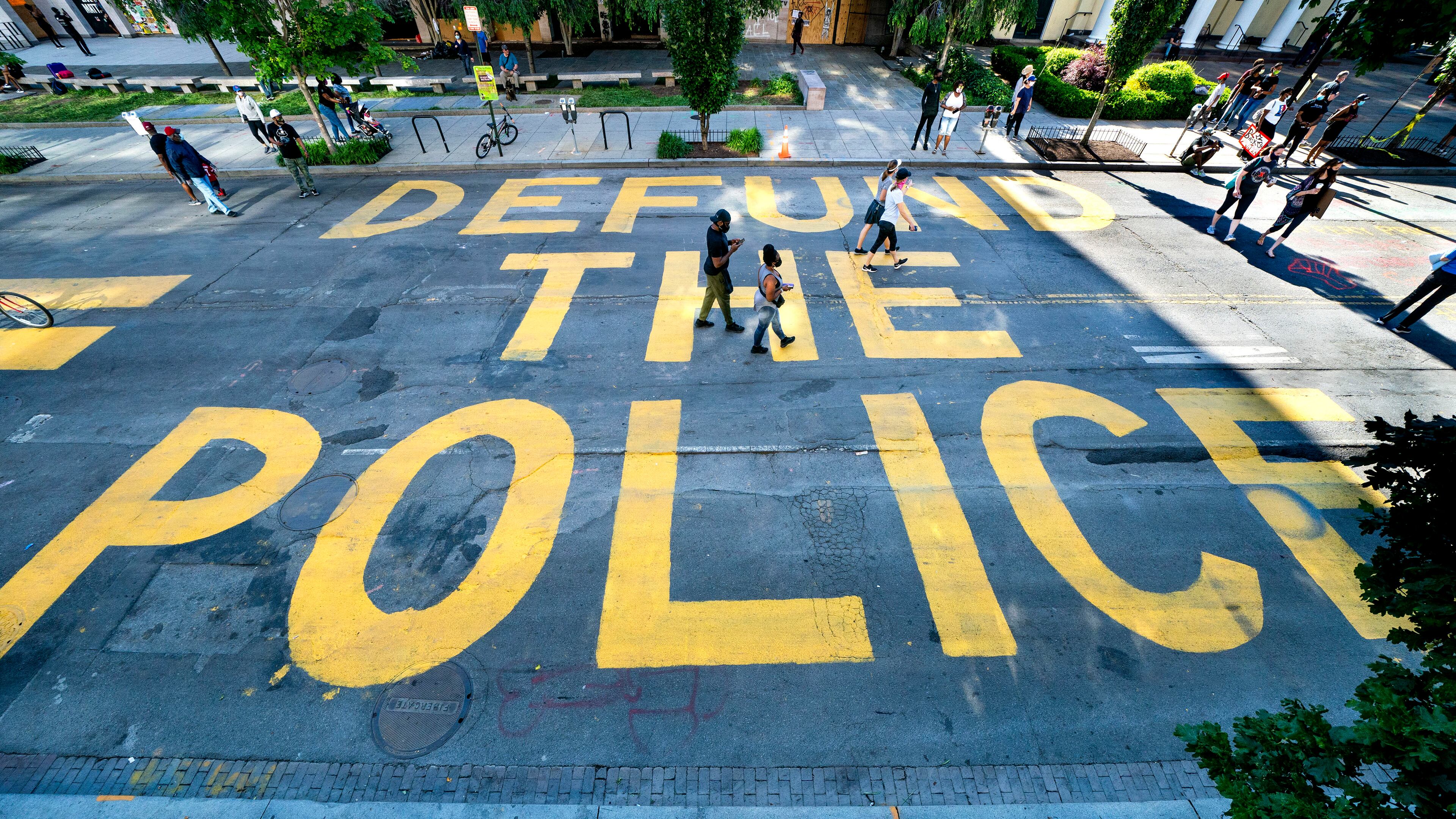 The words "Defund the Police" were added by protesters alongside the words "Black Lives Matter" near the White House in Washington.