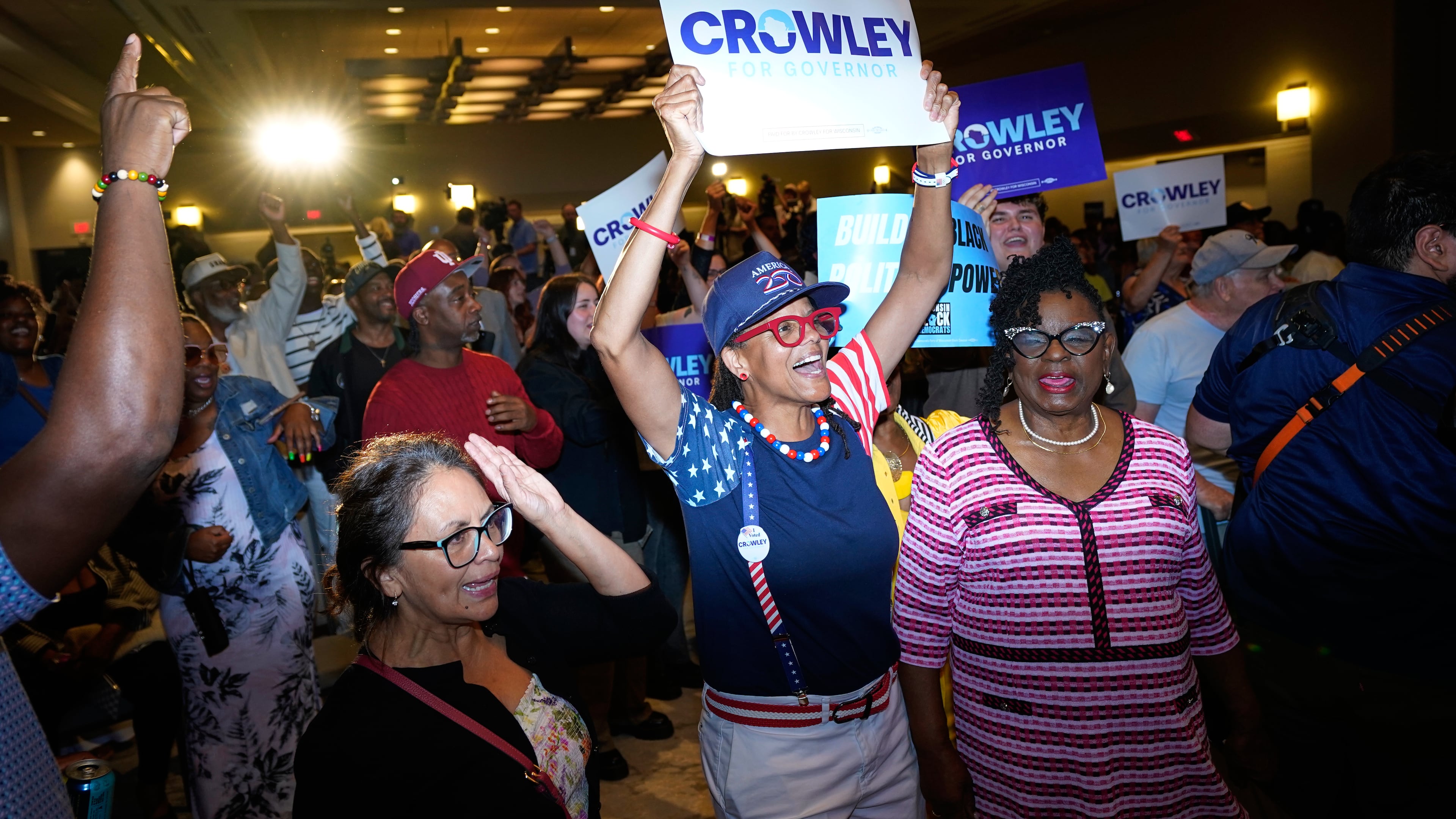 Supporters react to election results coming in during a primary election night watch party for Democratic gubernatorial candidate David Crowley, Tuesday, Aug. 11, 2026, in Milwaukee, Wis. (AP Photo/Kayla Wolf)