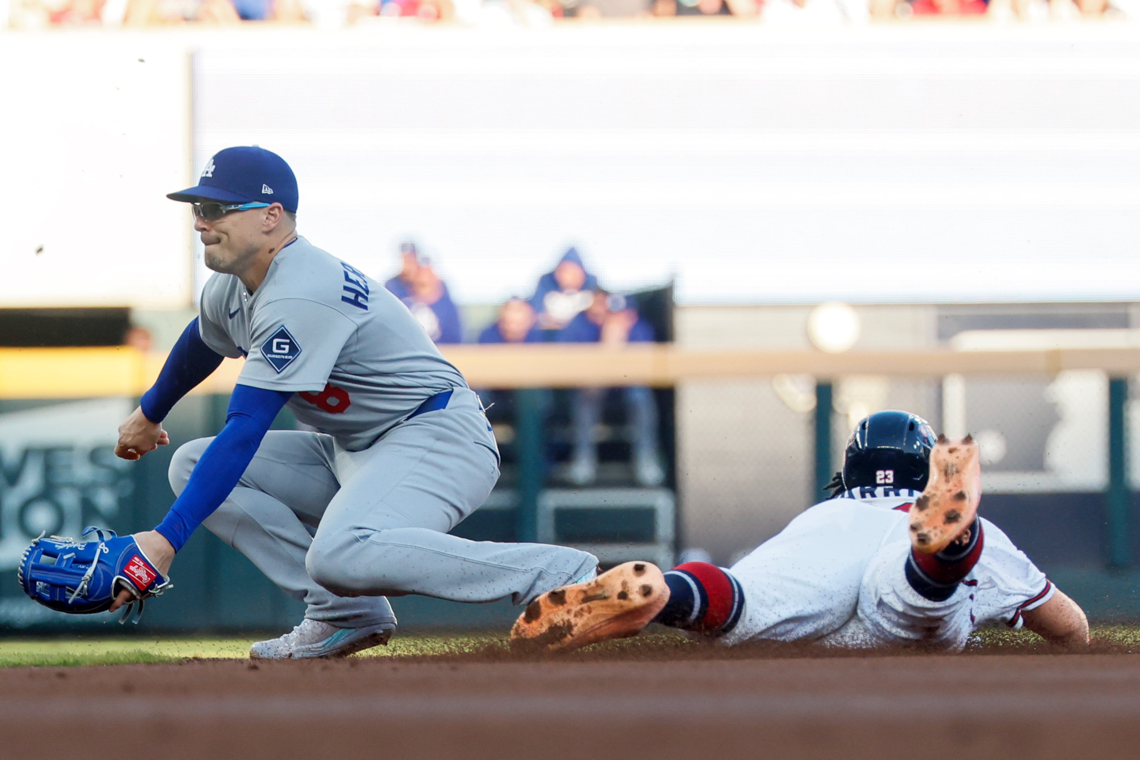 Atlanta Braves' Michael Harris II, right, steals second base against Los Angeles Dodgers second baseman Enrique Hernandez, left, during the first inning of Game 4 of the MLB National League Division Series between the Atlanta Braves and the Los Angeles Dodgers, Wednesday, Oct. 7, 2026, in Atlanta. (Miguel Martinez/AJC)