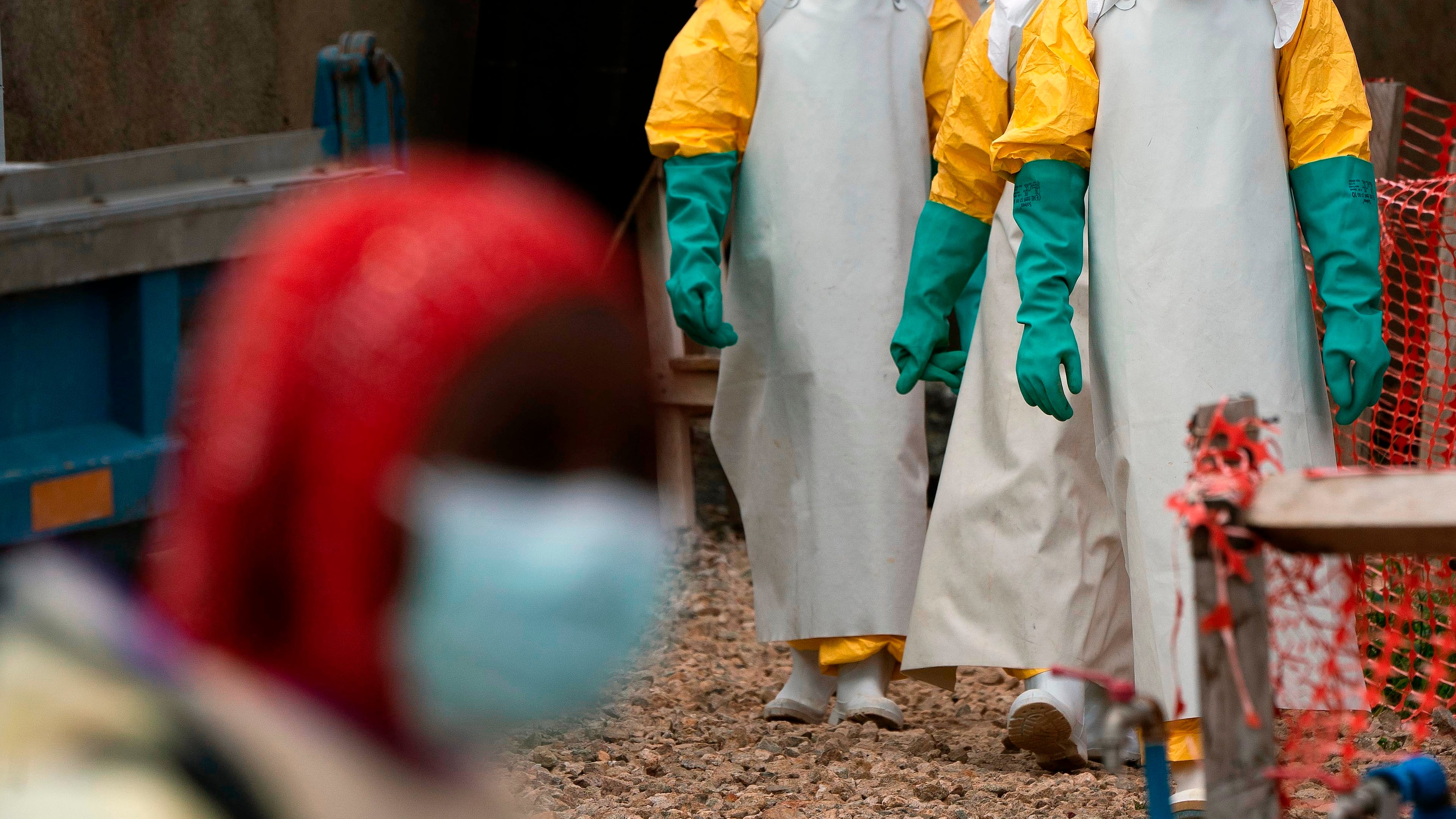 FILE - Health workers dressed in protective gear begin their shift at an Ebola treatment center in Beni, Congo, July 16, 2019. (AP Photo/Jerome Delay, File)