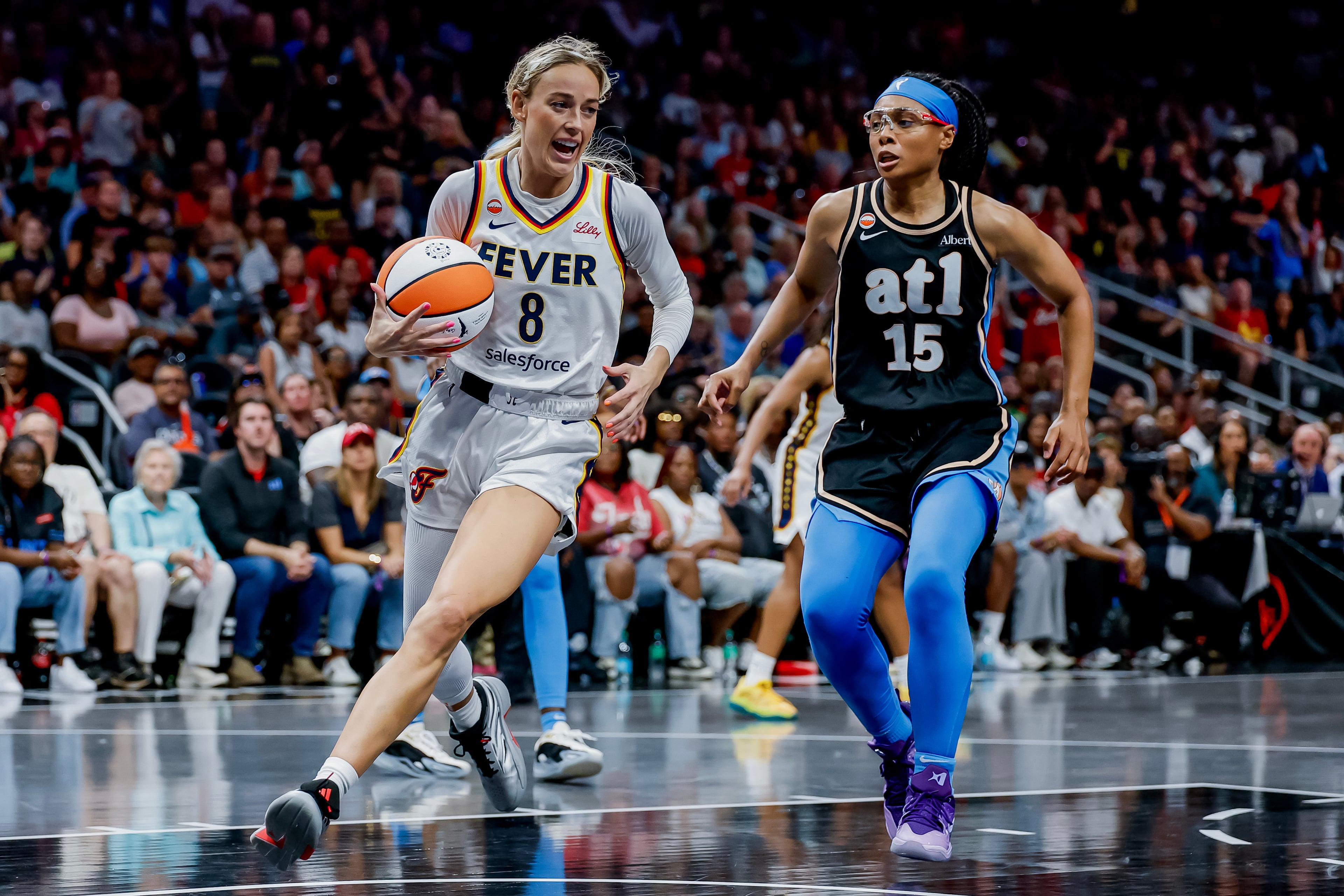 Cunningham (left) drives against Gray during overtime. (Erik S. Lesser for the AJC)