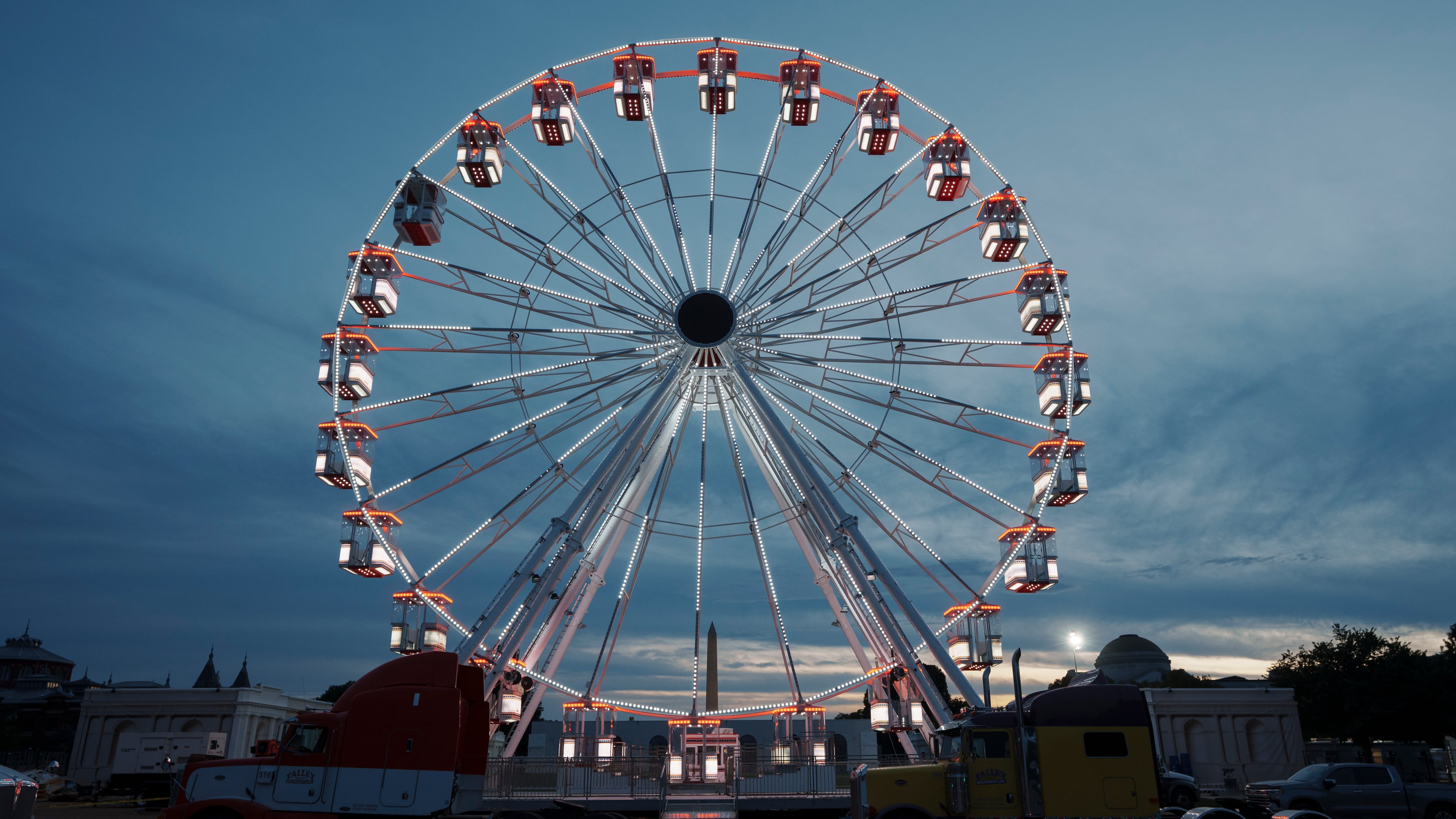 The ferris wheel on the National Mall is lit as preparation continues for the Great American State Fair on the National Mall, Sunday, June 21, 2026, in Washington. (AP Photo/Jon Elswick