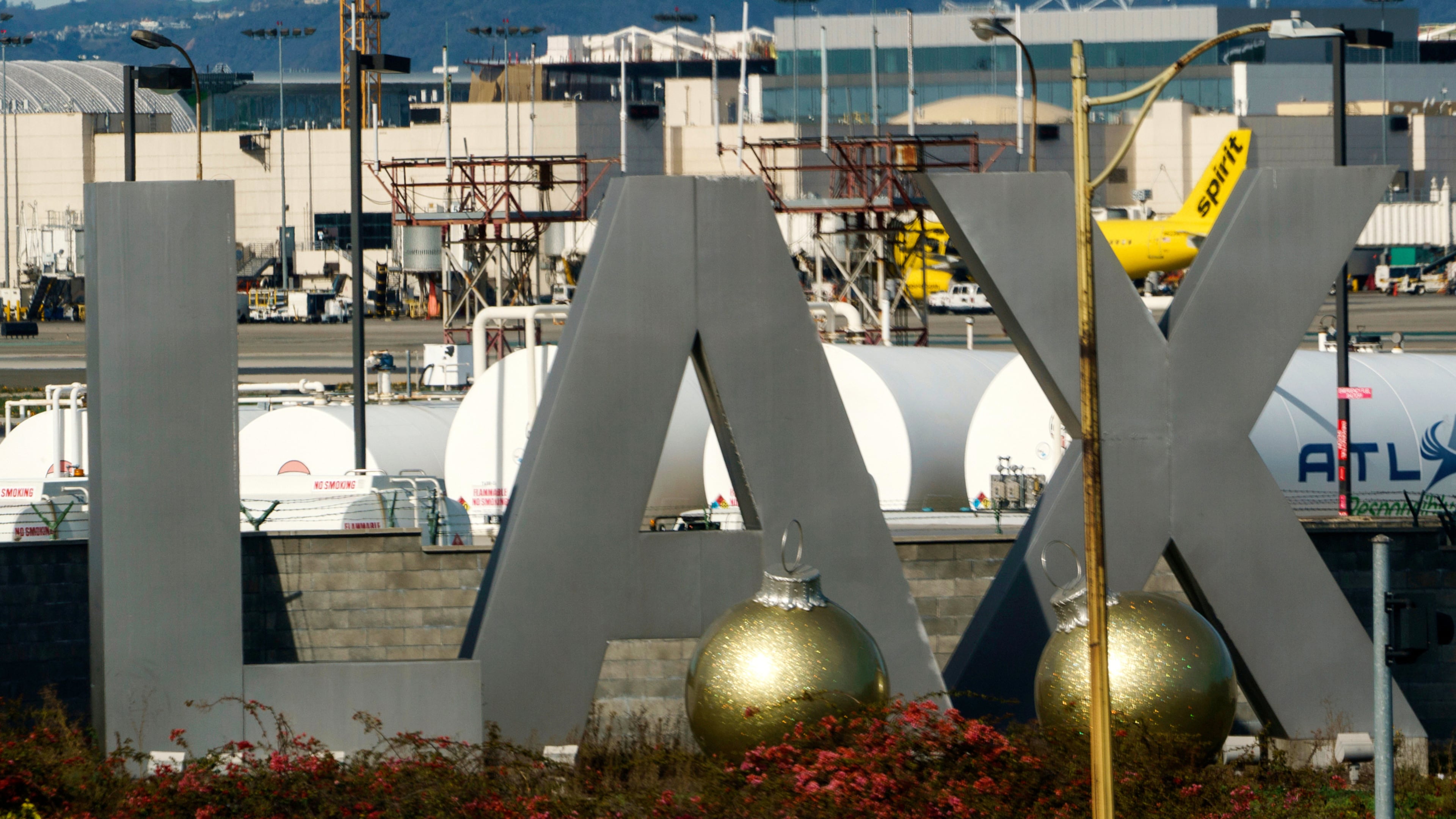 FILE - Air traffic is seen on the runway at Los Angeles International Airport on Sunday, Dec. 25, 2022. (AP Photo/Damian Dovarganes, File)