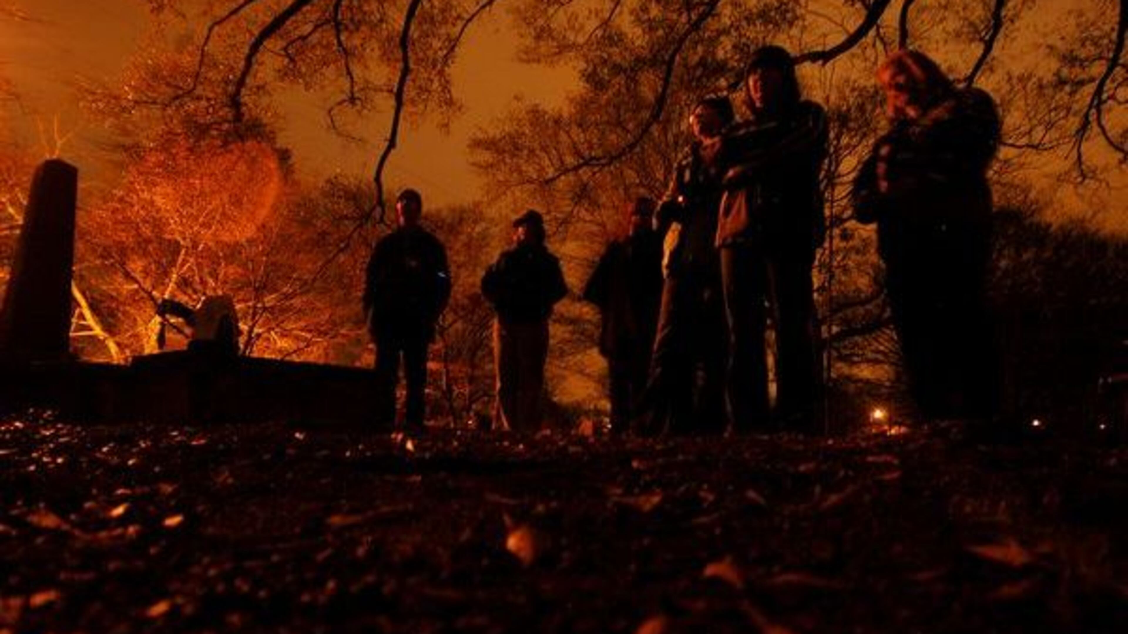 The group on the Roswell Ghost Tour stands on hollow ground in Founder's Cemetery, where 28 marked graves contain the remains of the first families of Roswell.