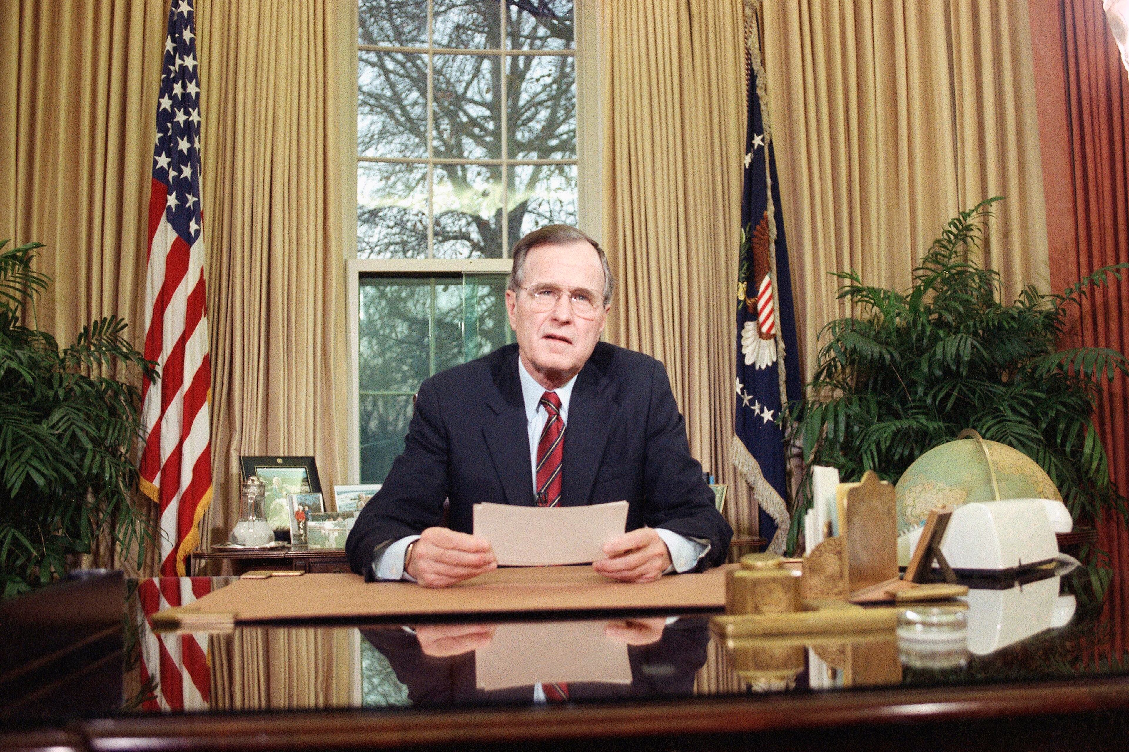 President Bush addresses the nation on television from the Oval Office in Washington on Wednesday, Dec. 20, 1989 as he explains his decision to deploy American troops to Panama. Bush said some Americans were among the death and that Panamanian leader Gen. Manuel Antonio Noriega was in hiding. (AP Photo/Barry Thumma)