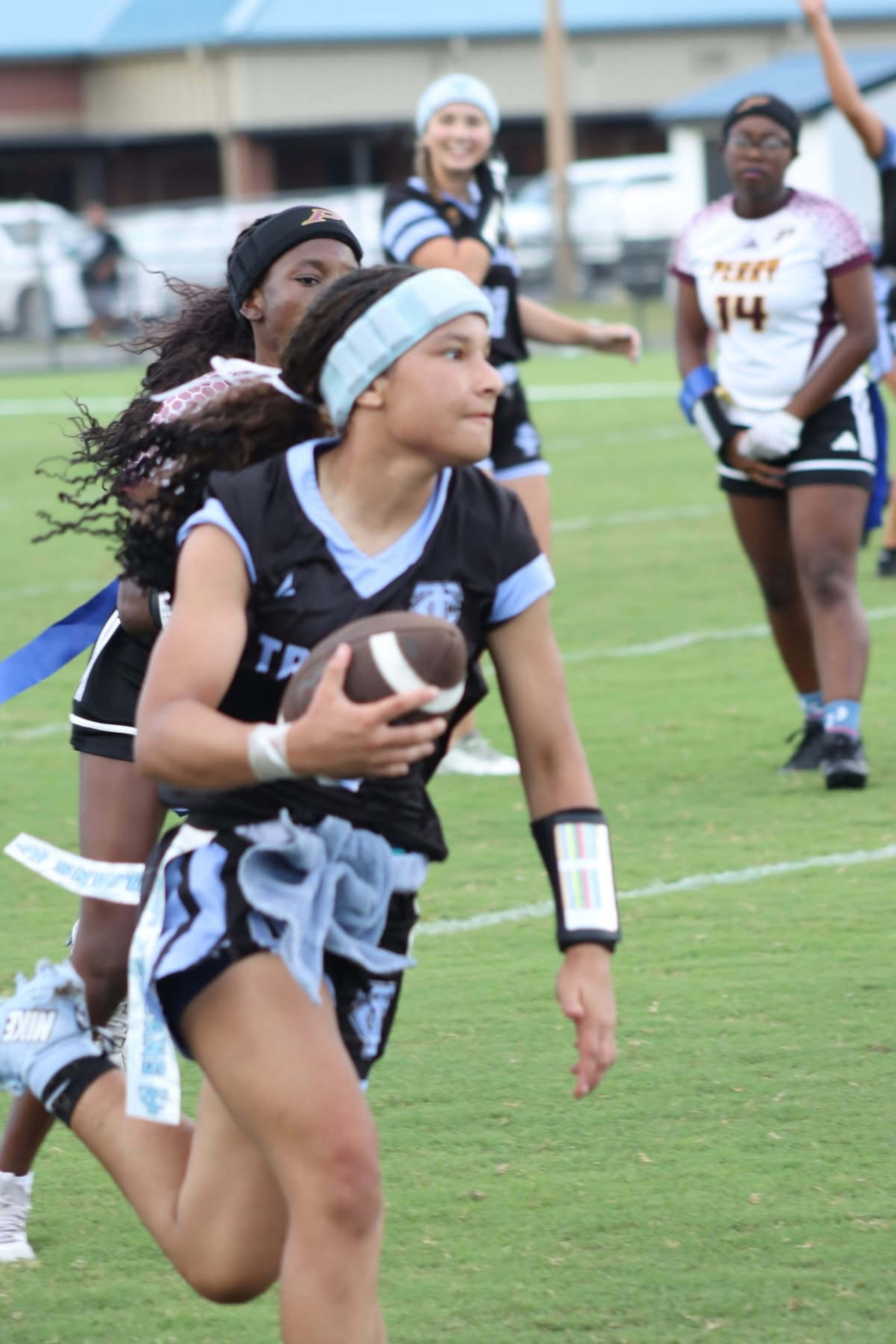 Hennessy Livingston is a two-sport standout, playing flag football and basketball. She began playing football in a tackle league in middle school.