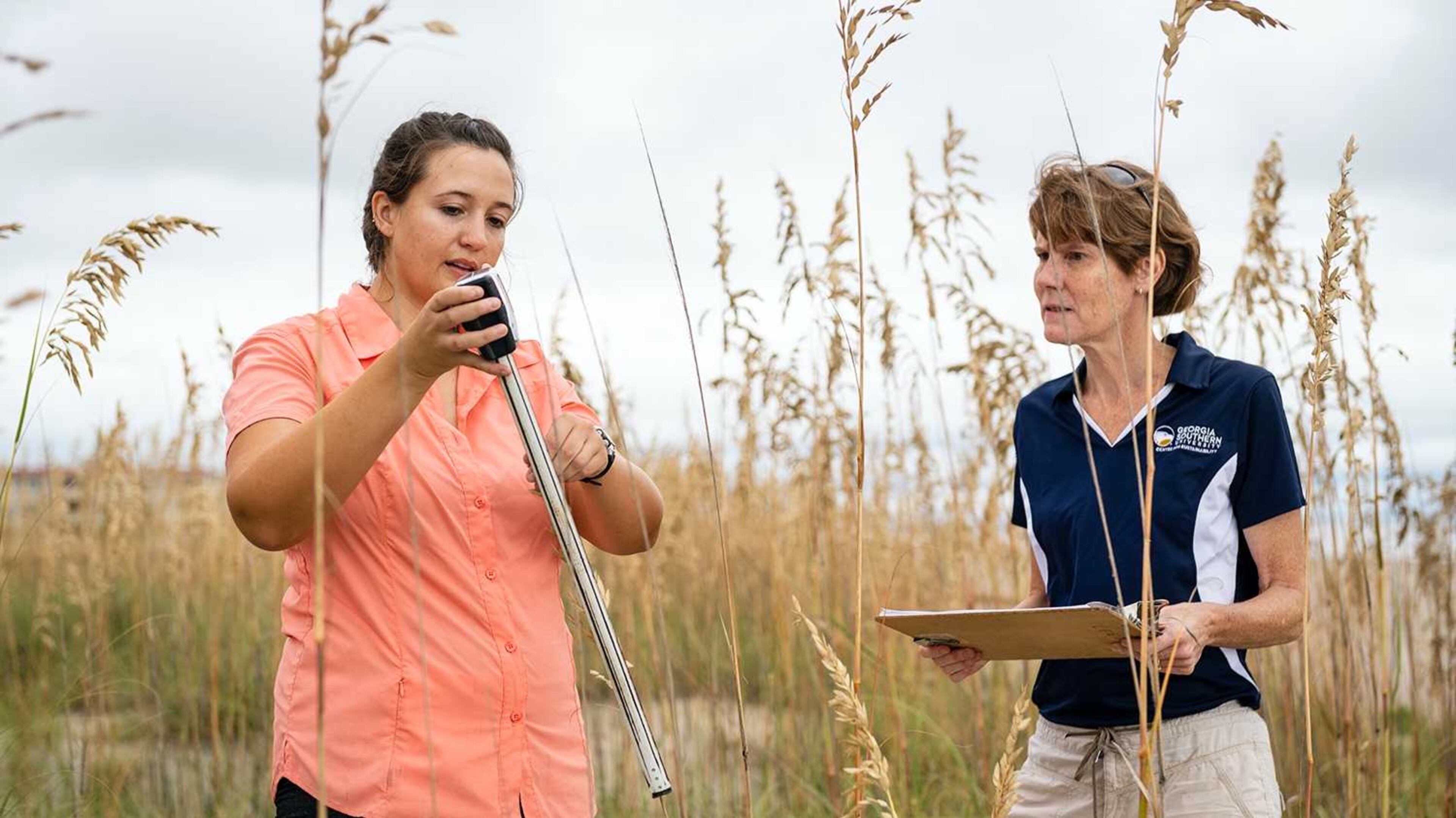 Georgia Southern University biology graduate student Shannon Matzke and her advisor, biology professor Lissa Leege, collect data for her sand dune restoration project. PHOTO CREDIT: GEORGIA SOUTHERN UNIVERSITY.
