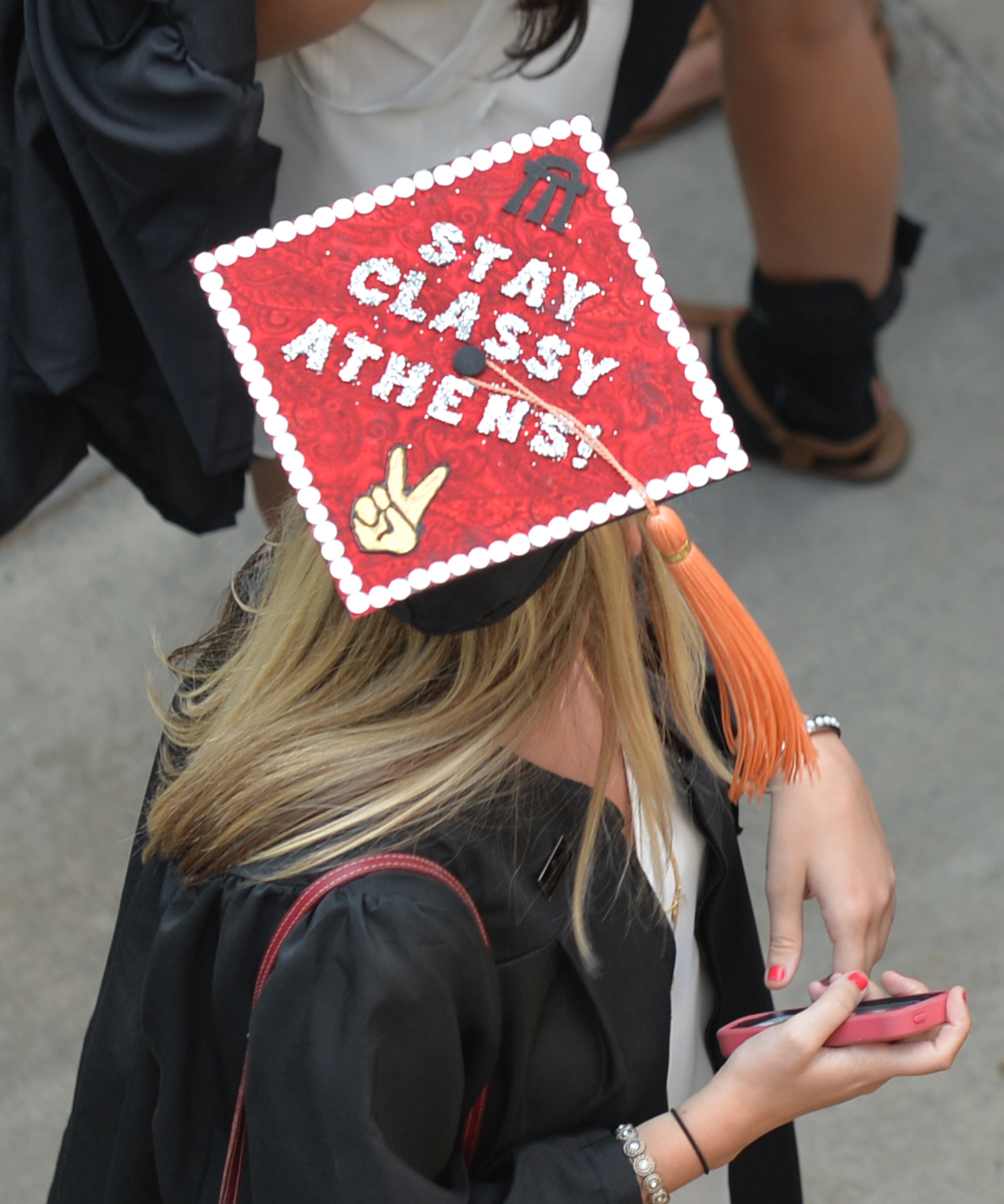 Many students personalize their mortarboards, a look at some of the eye catchers. University of Georgia undergraduate commencement at Sanford Stadium Friday May 8, 2015. BRANT SANDERLIN/BSANDERLIN@AJC.COM