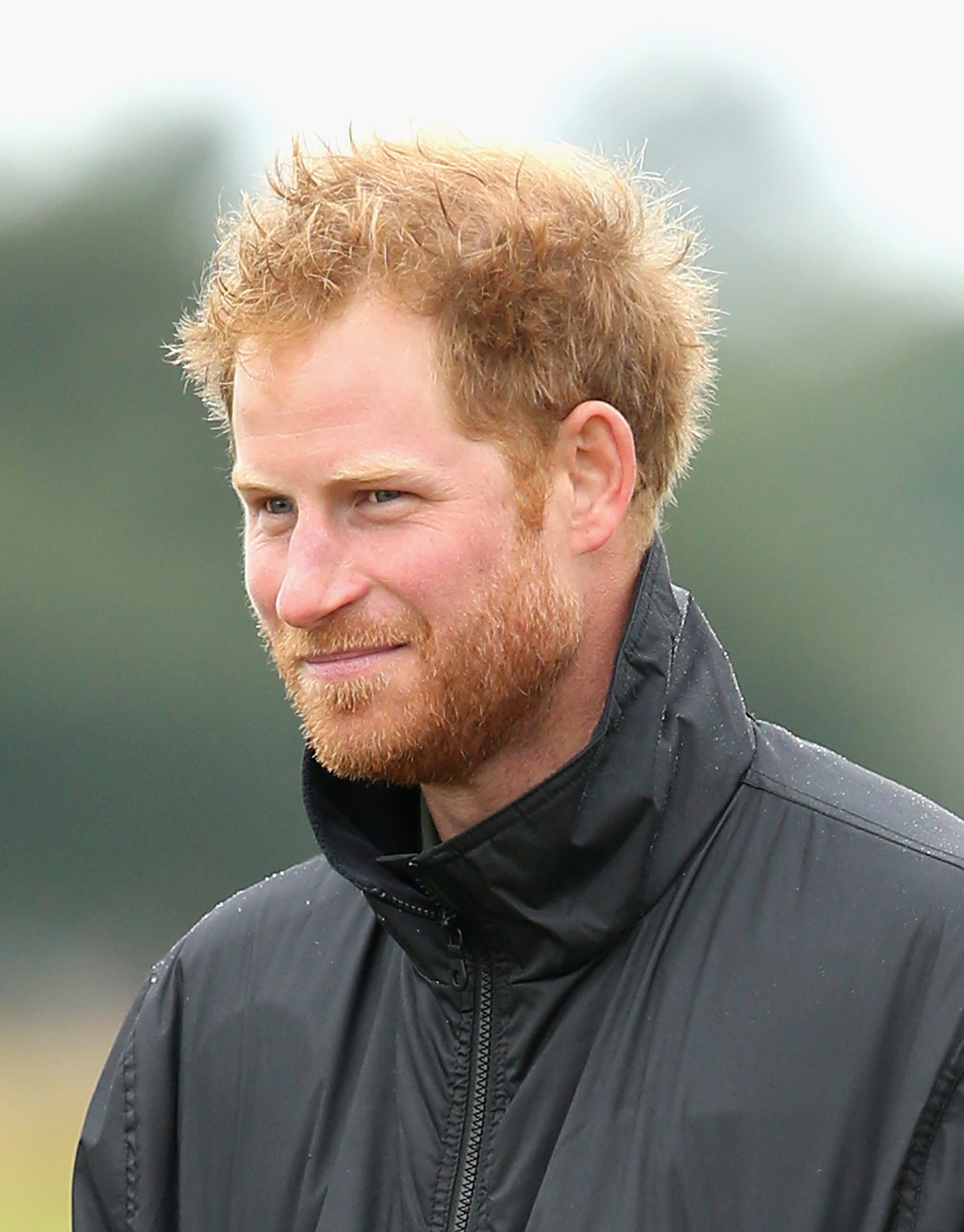CHICHESTER, ENGLAND - SEPTEMBER 15: Prince Harry walks on the airfield at Goodwood Aerodrome as he is shown Spitfire Aircraft that will take place in a Battle of Britain Flypast at Goodwood on September 15, 2015 in Chichester, England. The 75th Anniversary of the Battle of Britain is being marked by a historic flypast that brings more Battle of Britain aircraft together than ever before as a show of thanks to 'the few' and the sacrifices they made. (Photo by Chris Jackson/Getty Images)