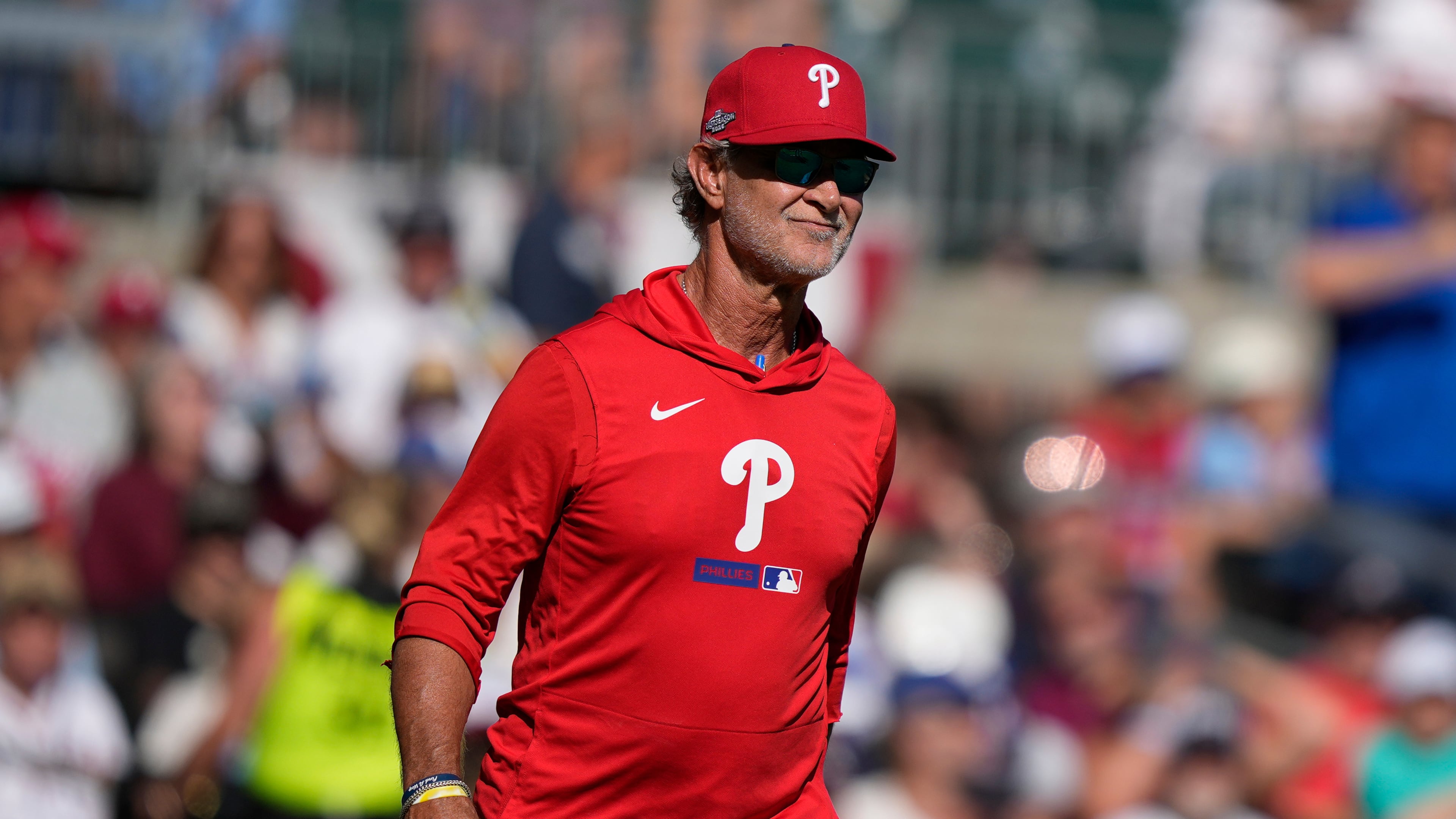 Philadelphia Phillies interim manager Don Mattingly walks to the mound against the Atlanta Braves in the seventh inning during Game 2 of baseball's National League Wild Card Series Wednesday, Sept. 30, 2026, in Atlanta. (AP Photo/Brynn Anderson)