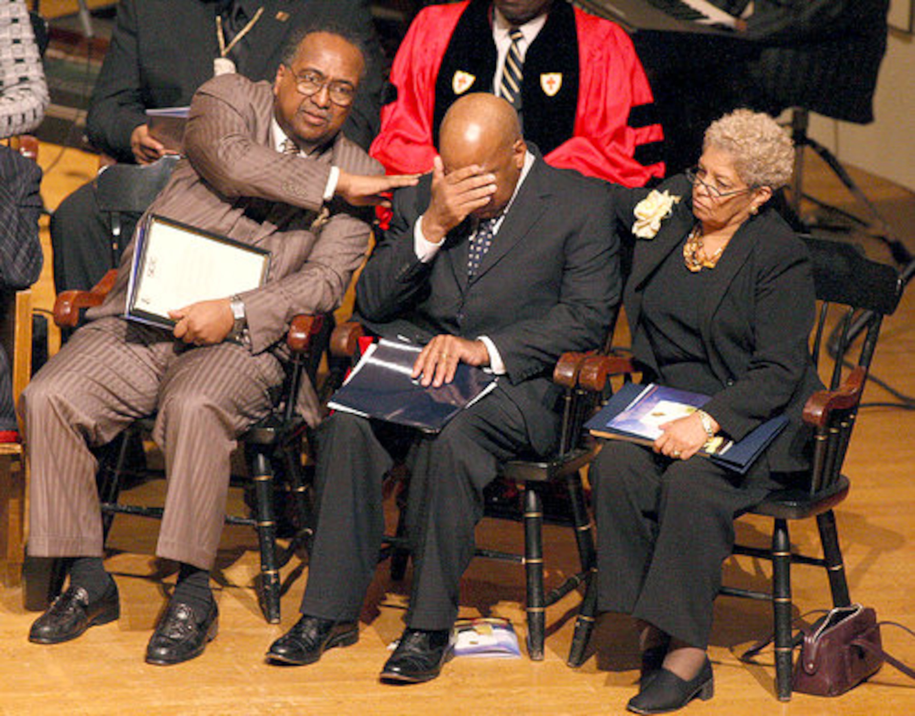 SCLC President Mr. Charles Steele Jr. along with Atlanta Mayor Shirley Franklin console Congressman John Lewis after he spoke during the funeral service.