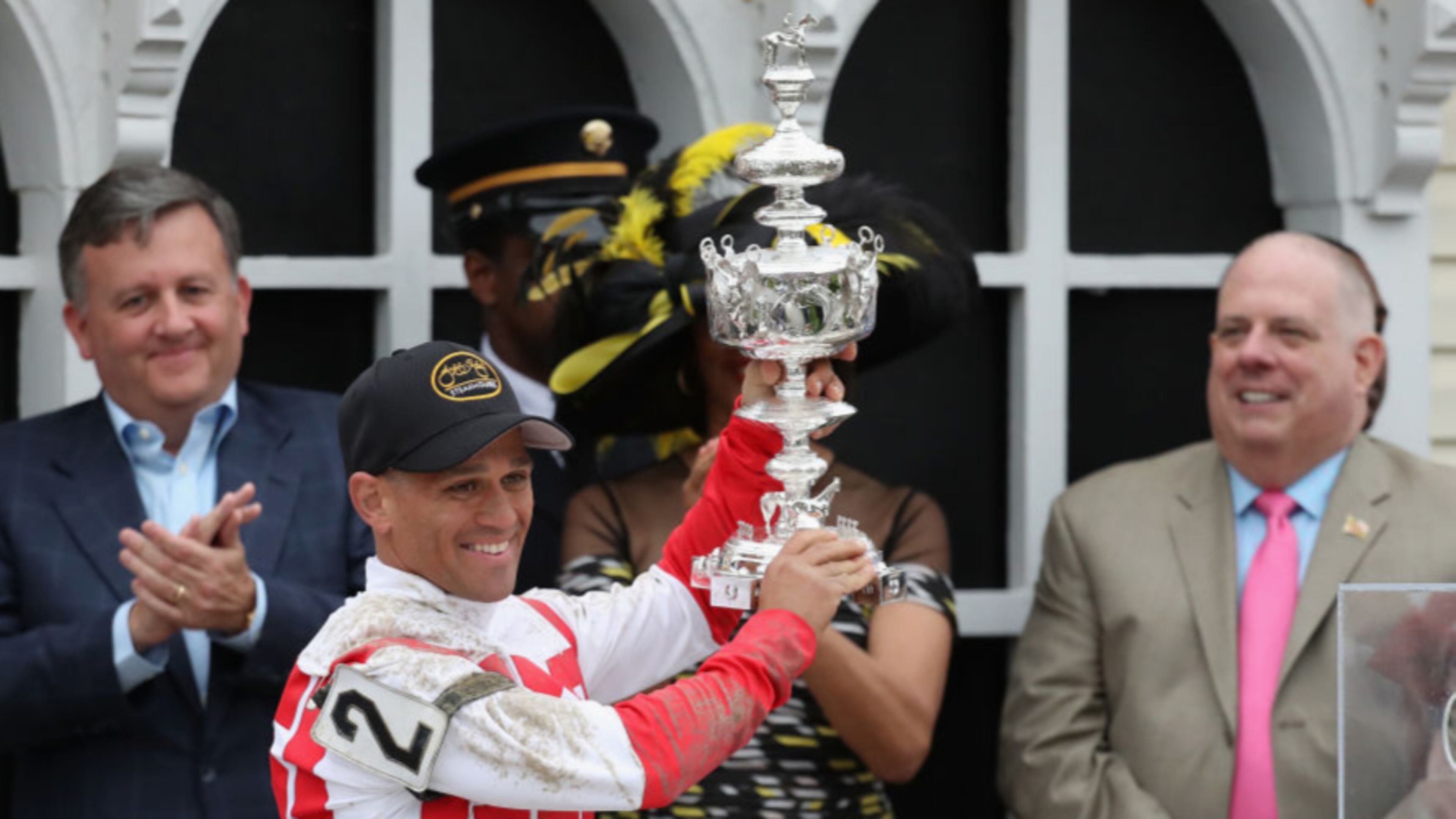 BALTIMORE, MD - MAY 20: Javier Castellano #2 rider of Cloud Computing celebrates with the trophy alongside Baltimore City Stephanie Rawlings-Blake and Maryland Governor Larry Hogan after winning the 142nd running of the Preakness Stakes at Pimlico Race Course on May 20, 2017 in Baltimore, Maryland. (Photo by Rob Carr/Getty Images)